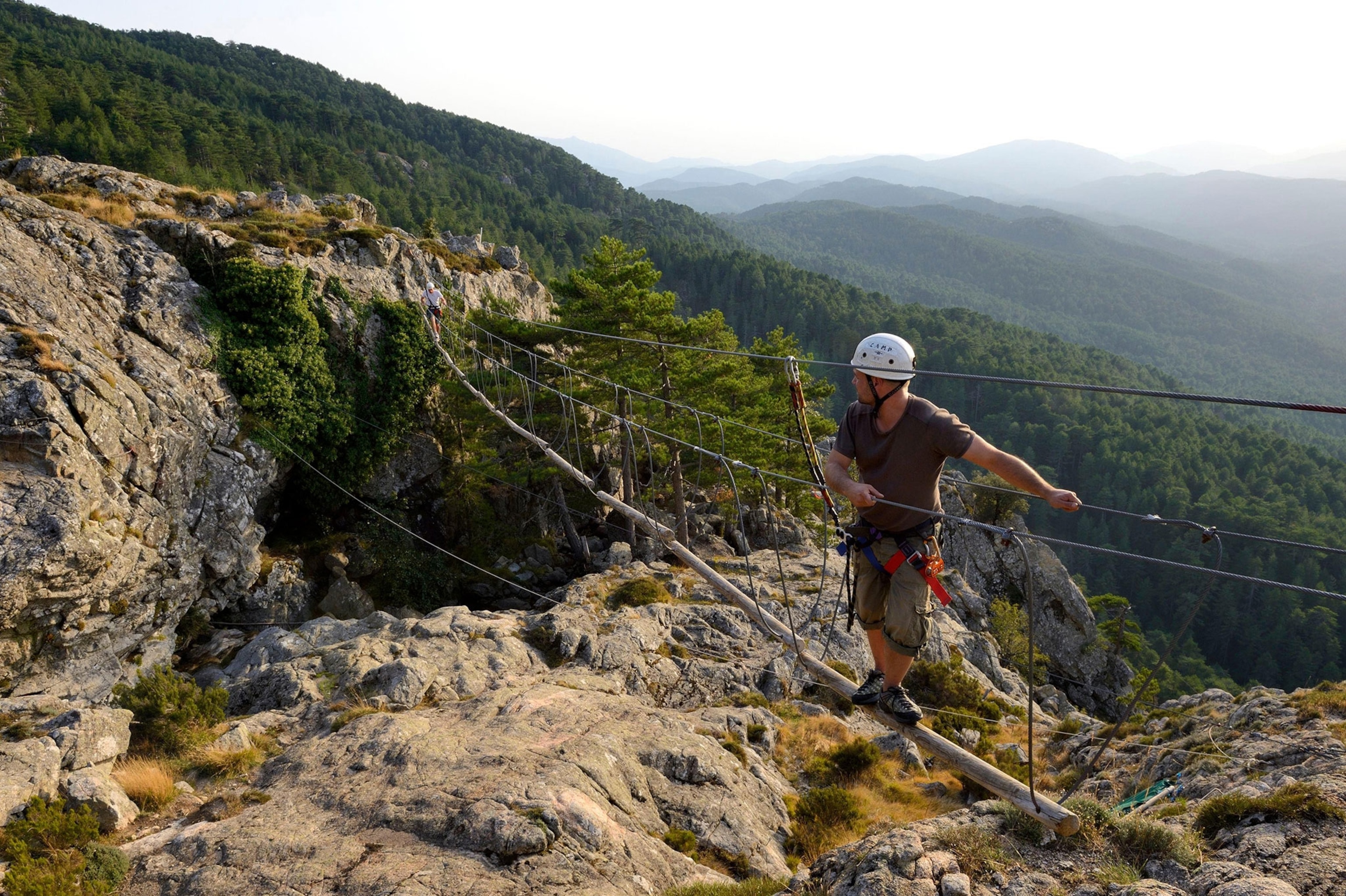a climber on a via ferrata in Bavella, Corsica