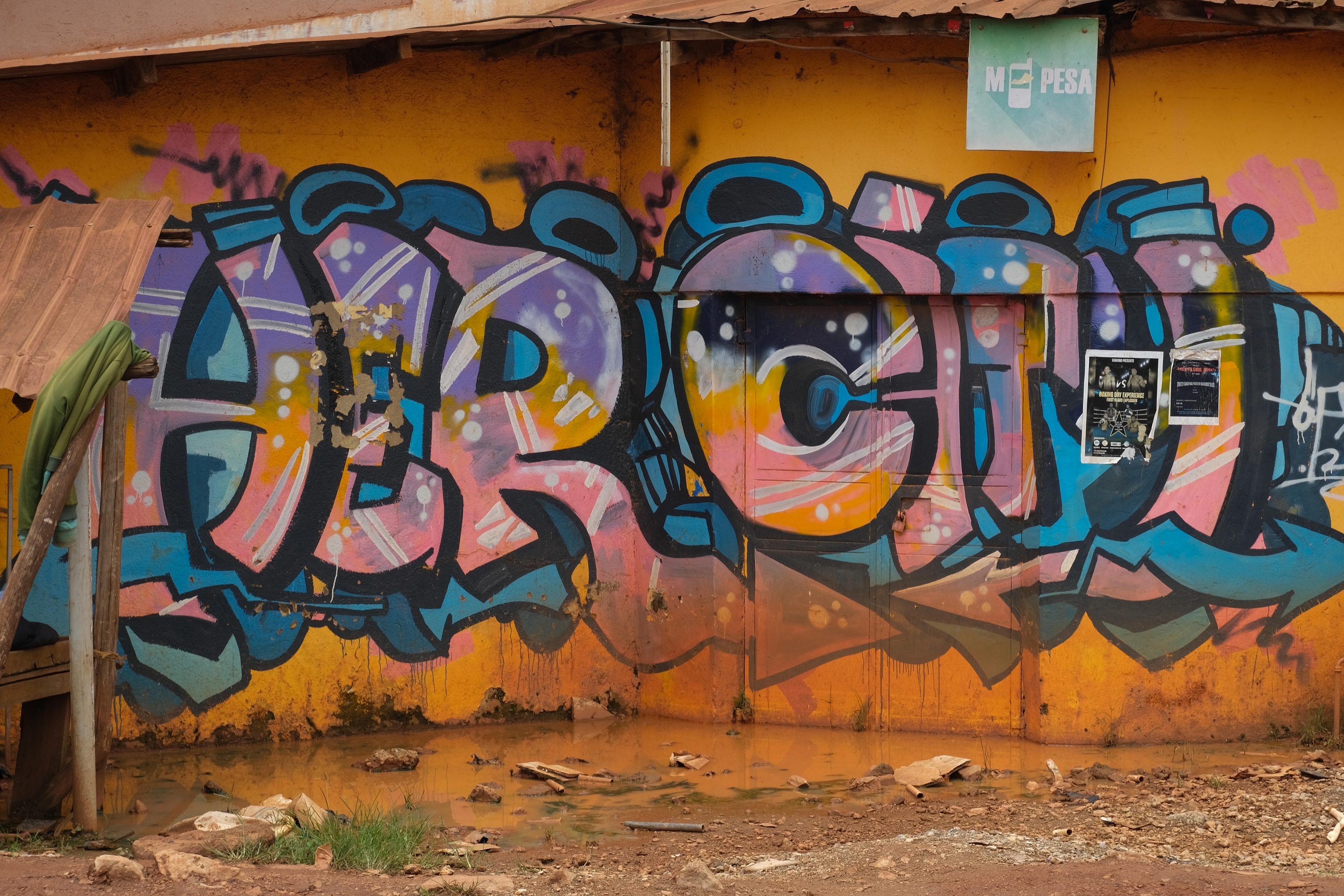 A building impacted by standing water next to Port Bell on April 07, 2025. photographed by student Bonny Arocha. The Uganda Photo Camp, held in Bamunanika from April 5-9, 2025, is part of a larger initiative exploring the interconnected themes of access, equality, and stewardship of freshwater resources across East Africa. During this transformative program, students collaborated with National Geographic explorers and Photo Camp staff, honing their photography and writing skills while building meaningful connections within their communities and peers.