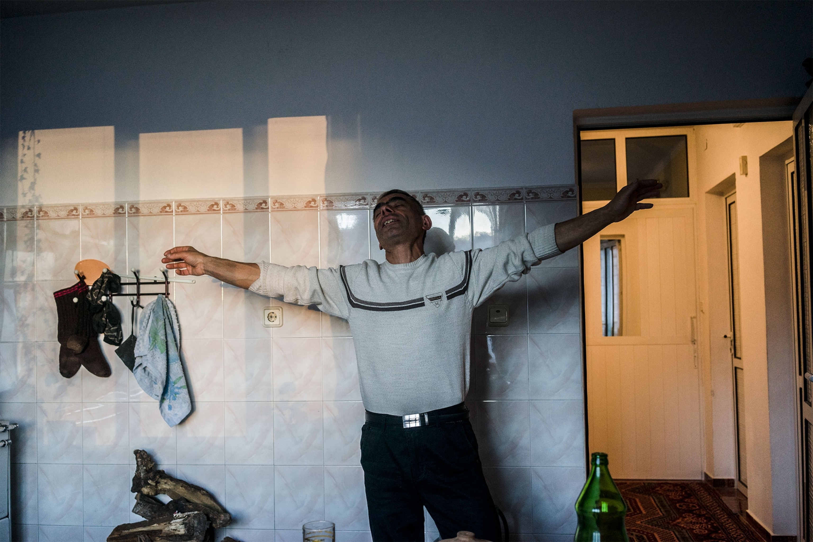 a man dancing in his kitchen