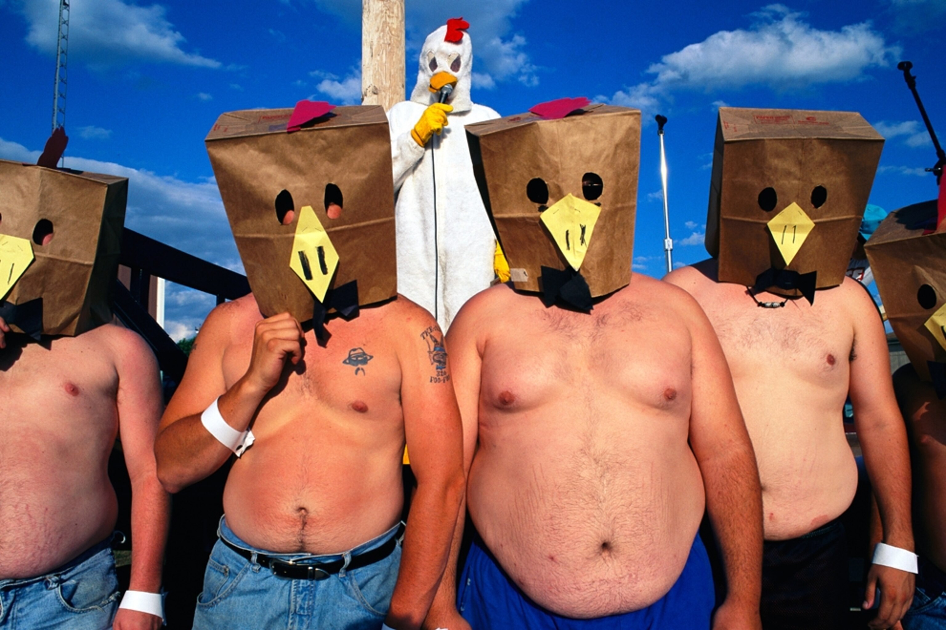 shirtless men with paper bags over their heads