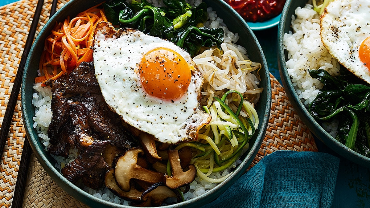 Colorful bibimbap bowl with vegetables and egg