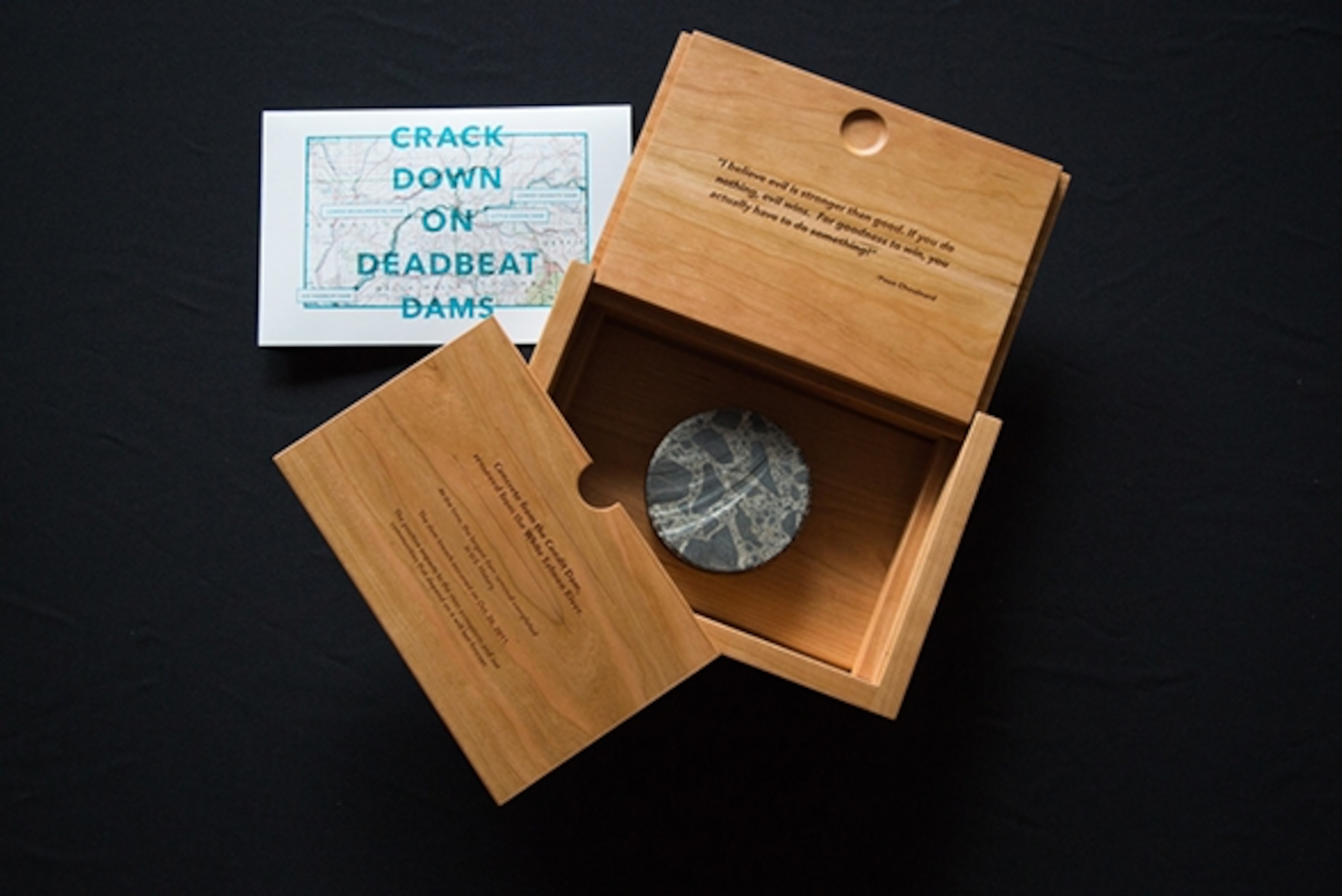 The DamNation team gave Council on Environmental Quality Chair Mike Boots, a top environmental adviser to President Obama, a box representing more than 60,000 petition signatures asking President Obama to “Crack Down on Deadbeat Dams,” starting with the four low value, high cost dams on the lower Snake River in Southeast Washington state; Photograph by Erin Feinblatt