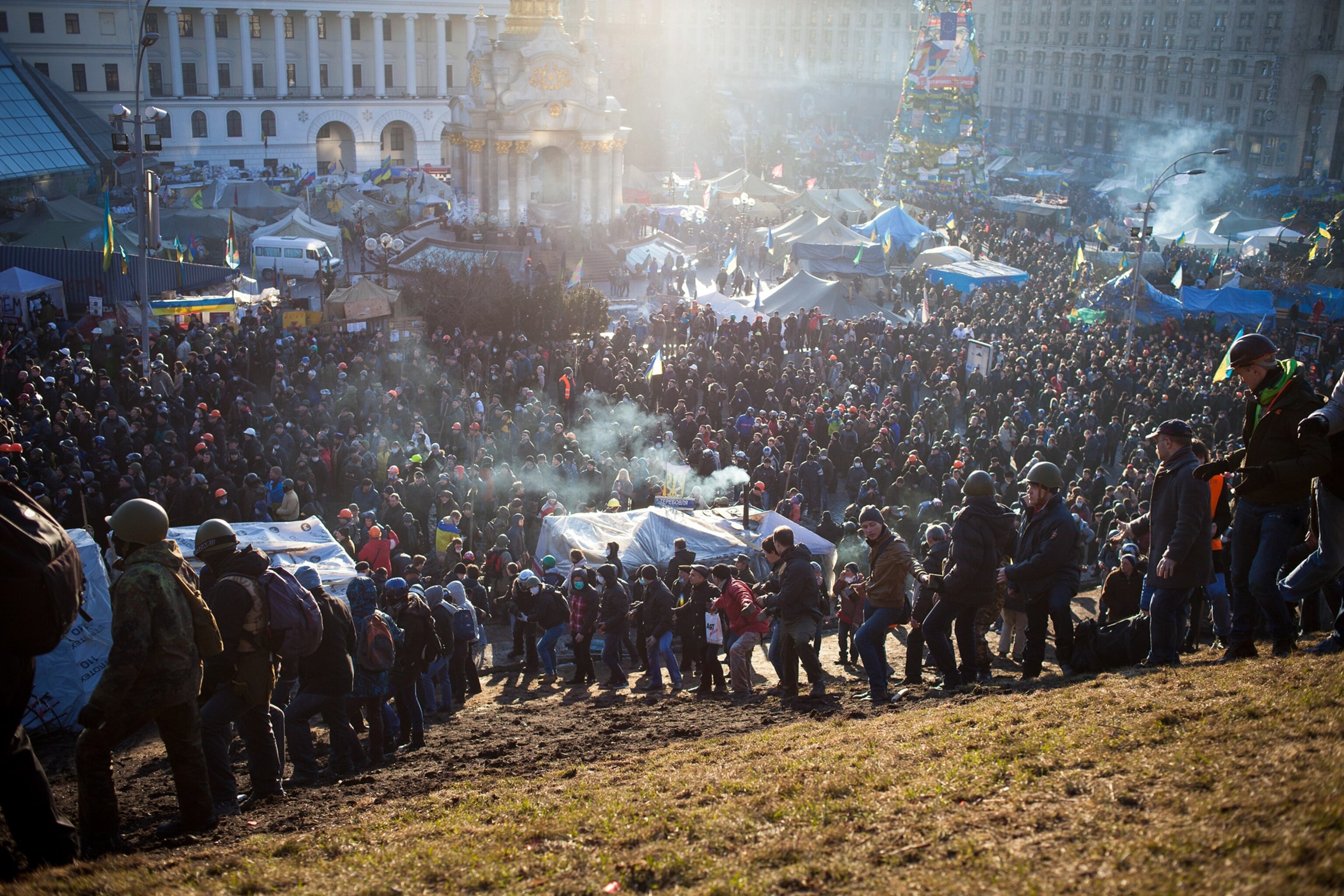 Anti-government protesters clash with riot police.