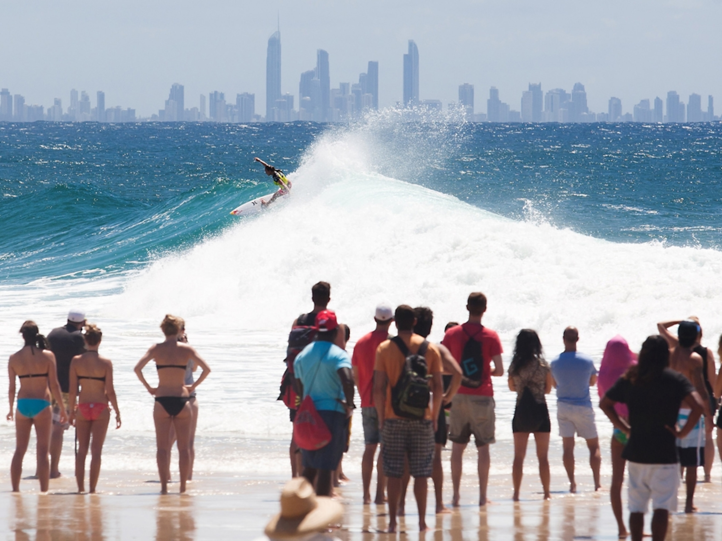a crowd of onlookers watching a surf competition in Gold Coast, Australia.