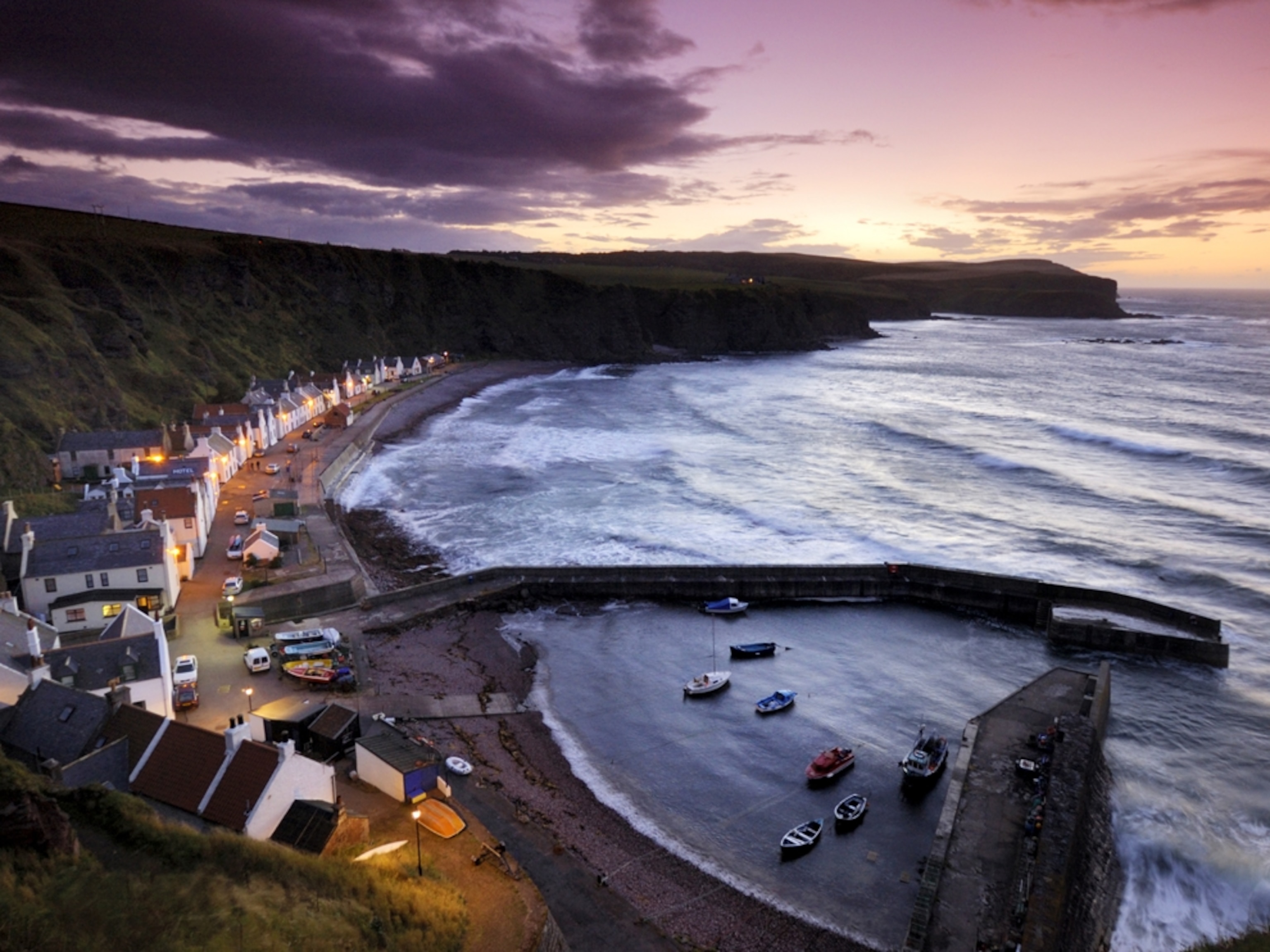 Pennan's cottages and boats on the Moray Firth at twilight
