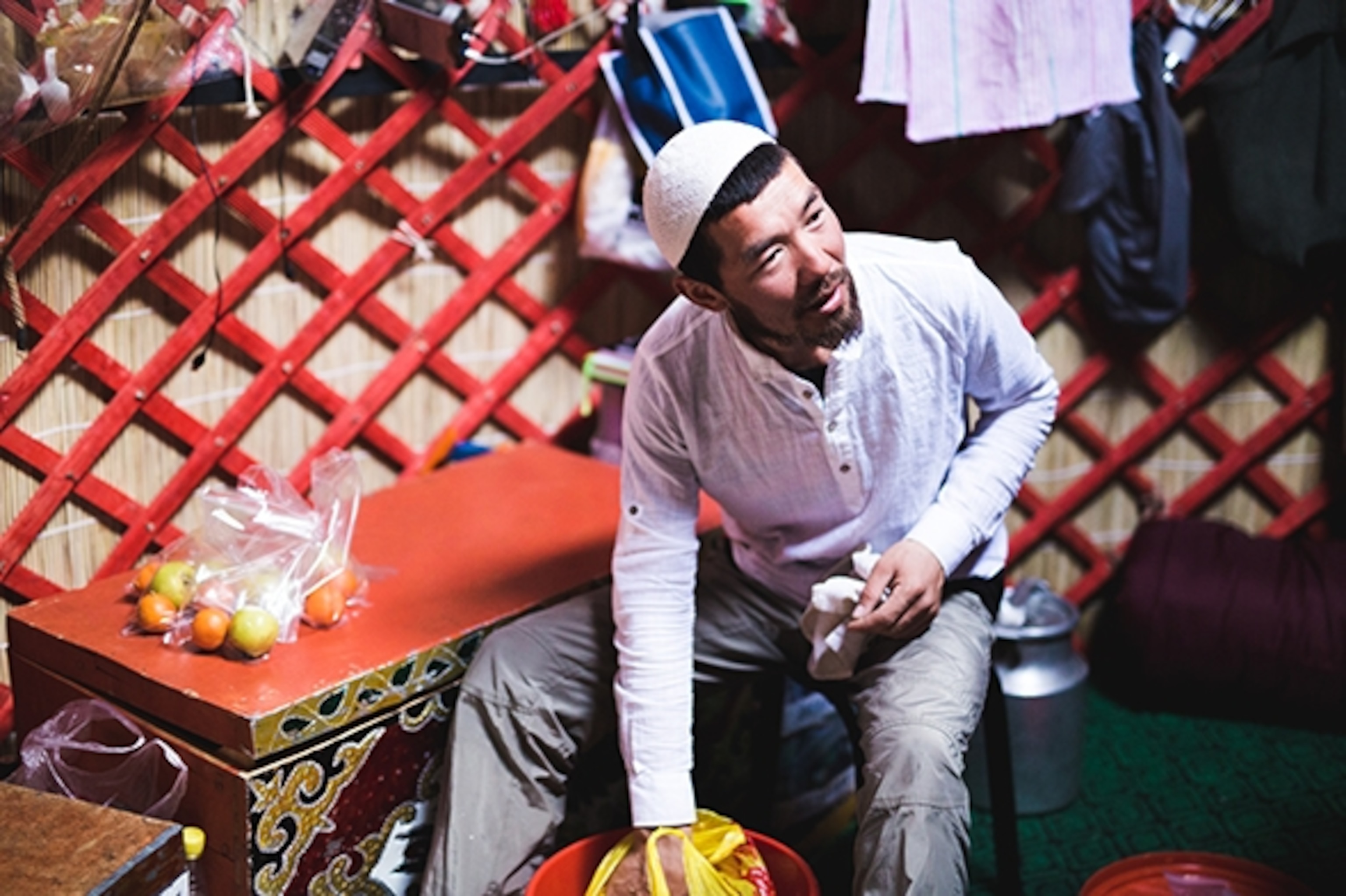 Kas, a 27-year-old local from one of the nearby villages, is the official yurt custodian, chef's assistant, and sometimes trail guide out in the field. He works tirelessly to ensure that the guests have the best experience possible in Kyrgyzstan, as he takes immense pride in his country and the Tien Shen mountain range. Kas is an aspiring guide and is working at the forefront of the tourism industry in Kyrgyzstan, with a focus on getting the youth into the outdoors and educating the locals about tourism and exploration; Photograph by Zoya Lynch