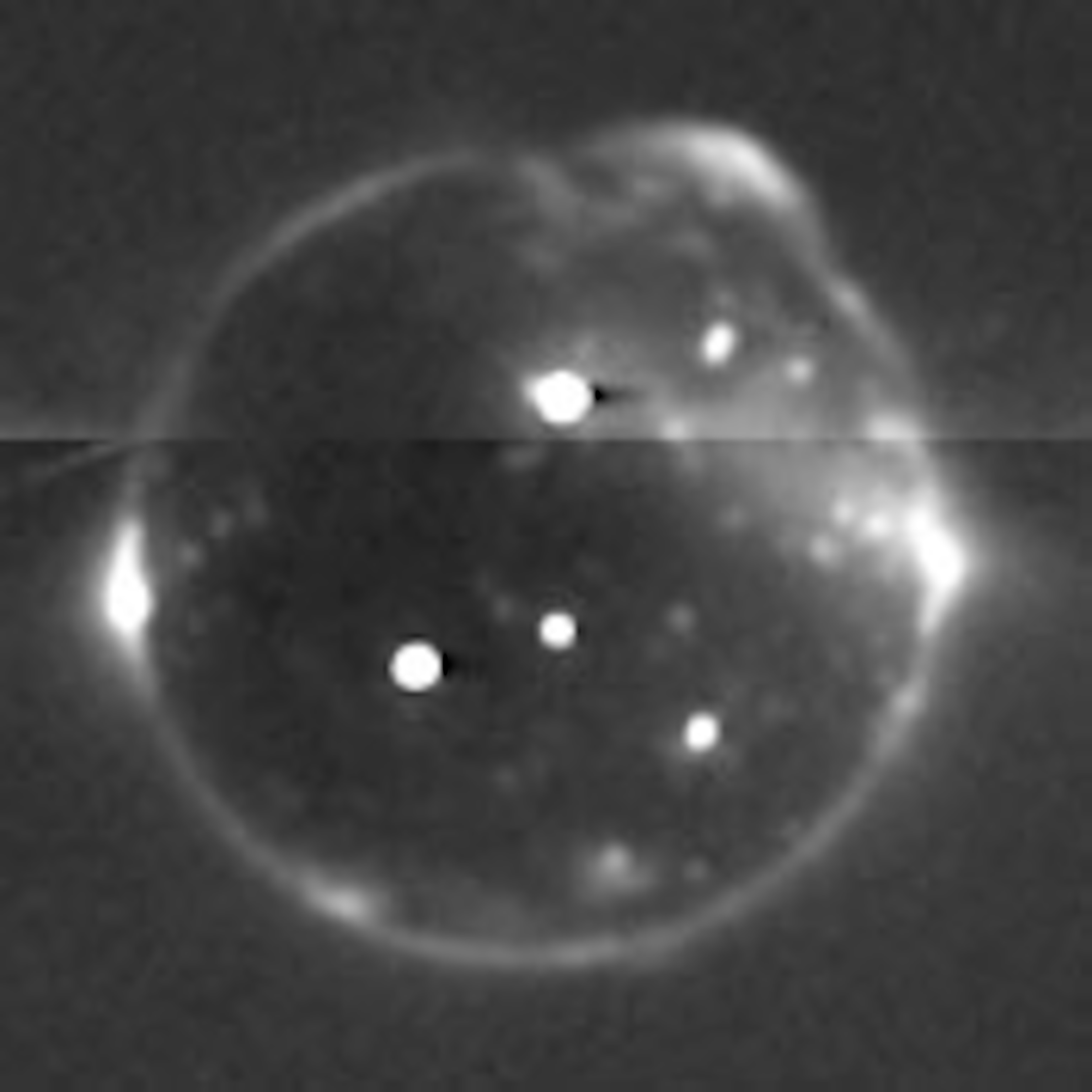 Eclipsed by Jupiter's shadow, Io's glowing lava and eerie auroras glimmer in the dark. (NASA/JHUAPL/SwRI)