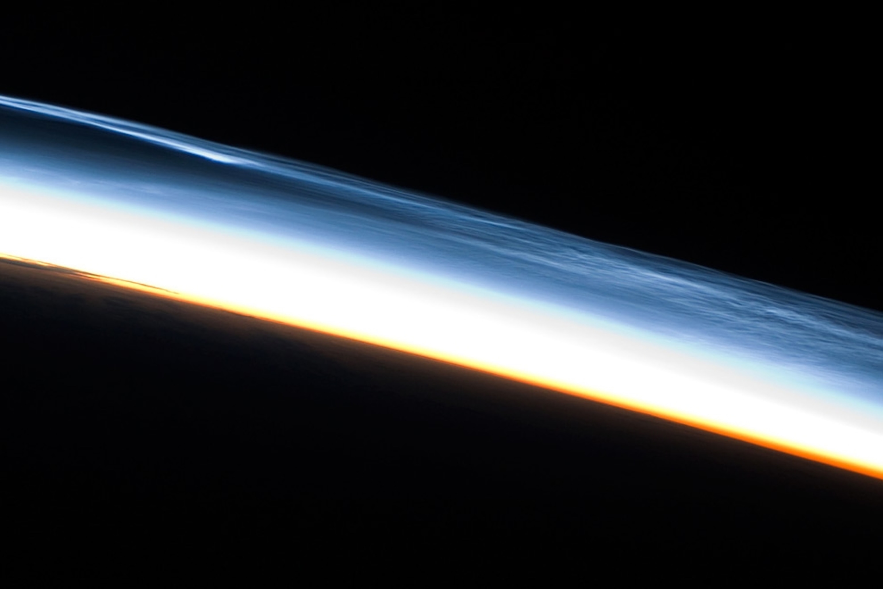 Night-shining clouds appear over the South Pole in an astronaut's photograph