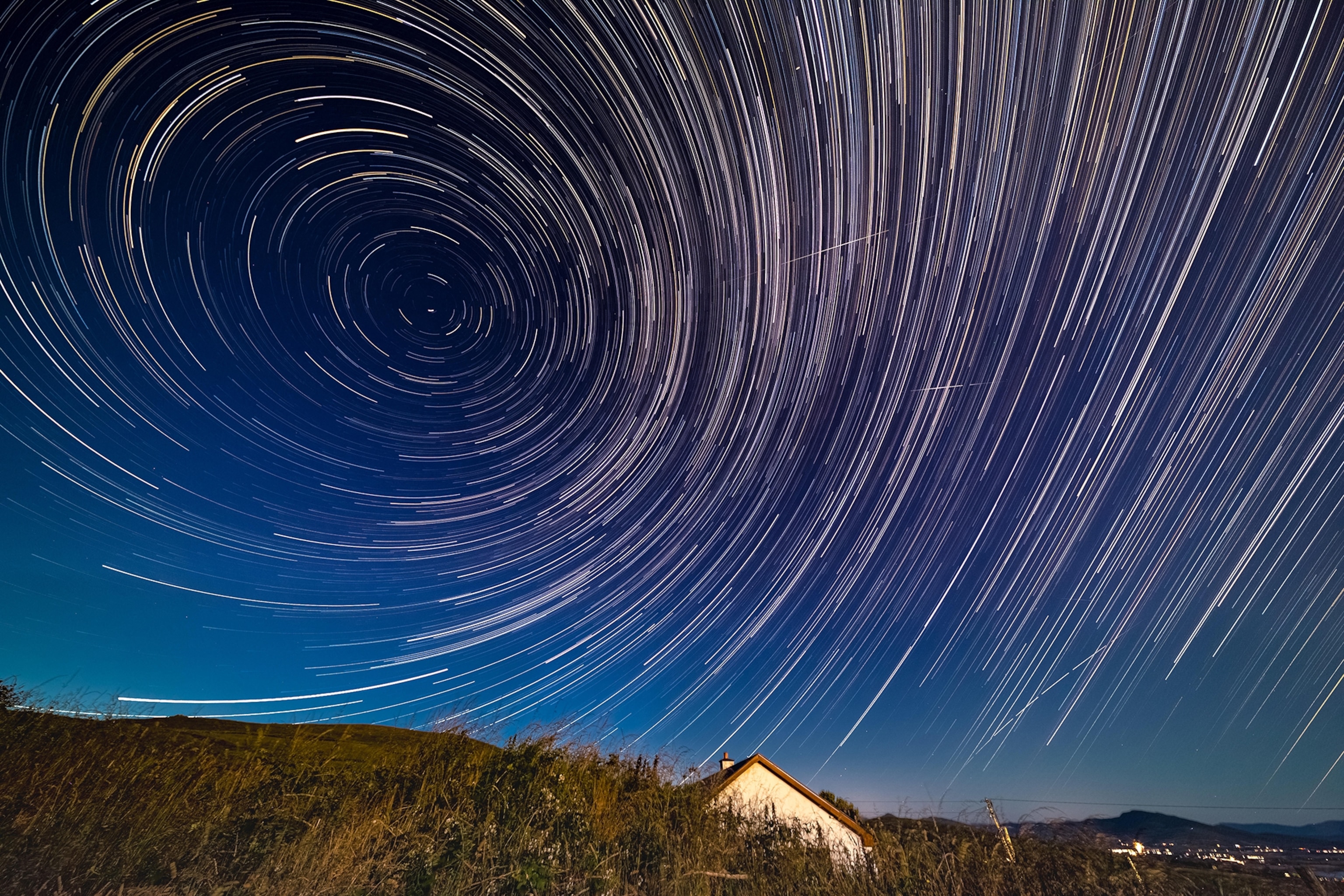 A night sky with swirls of light.