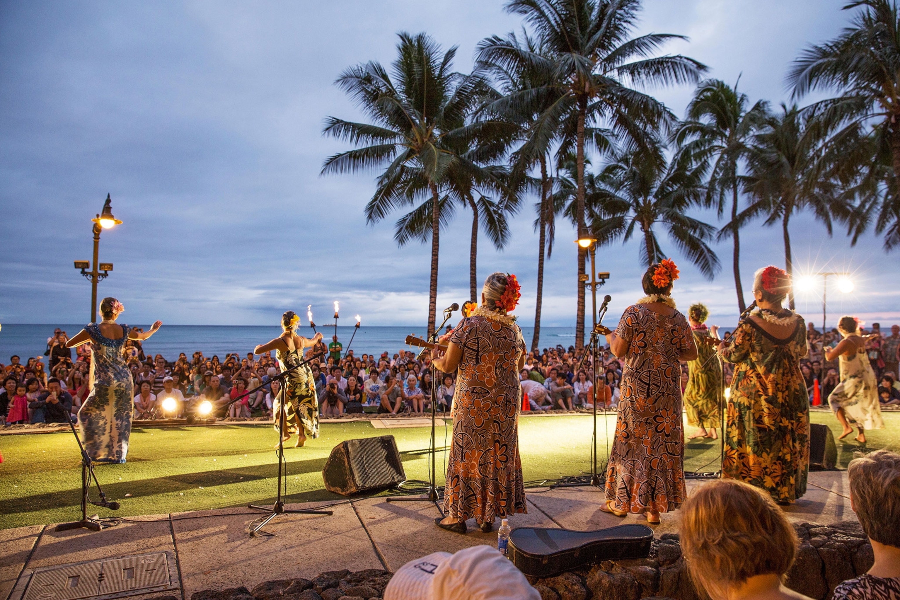 hula dancers performing at Waikiki Beach in Honolulu