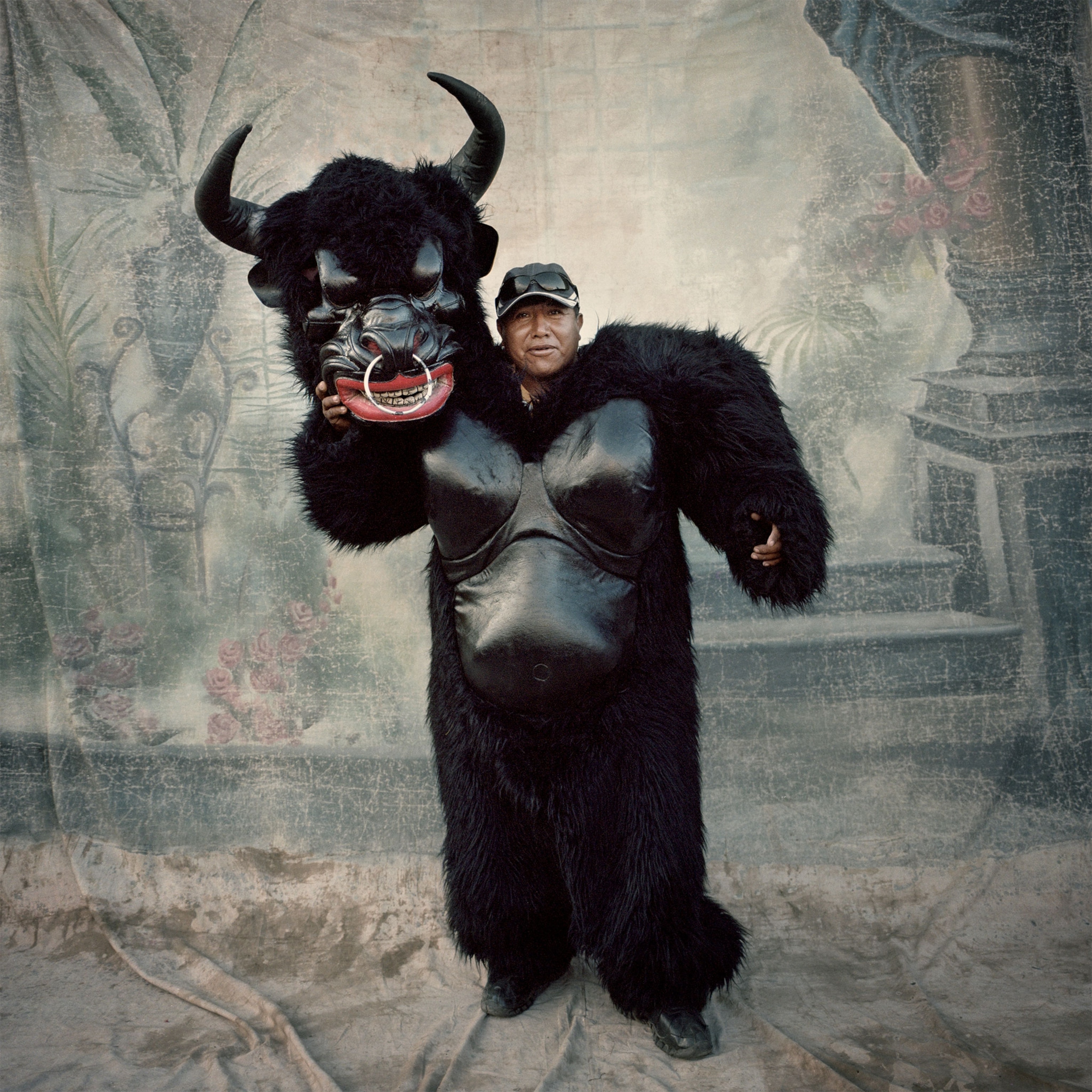 a man in a bull costume during the Candelaria Festival in Peru
