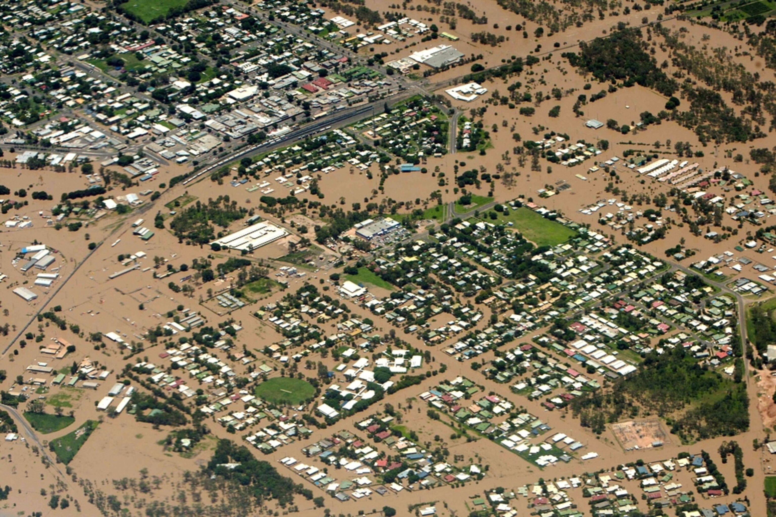 Brown water covers the town of Emerald, as seen from the air