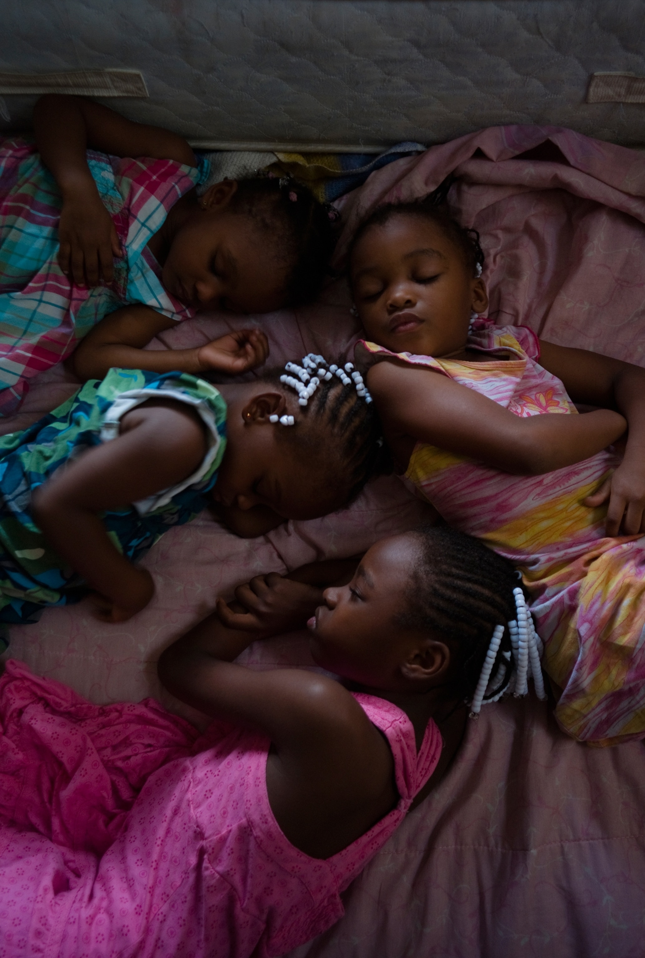 four young girls napping