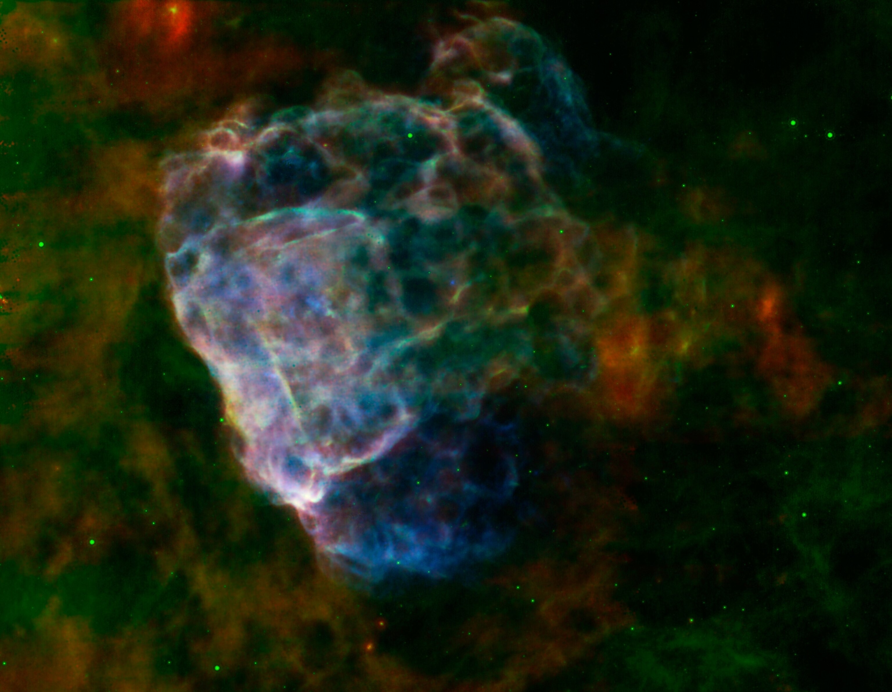a the bubbly cloud of a supernova seen in two lights.