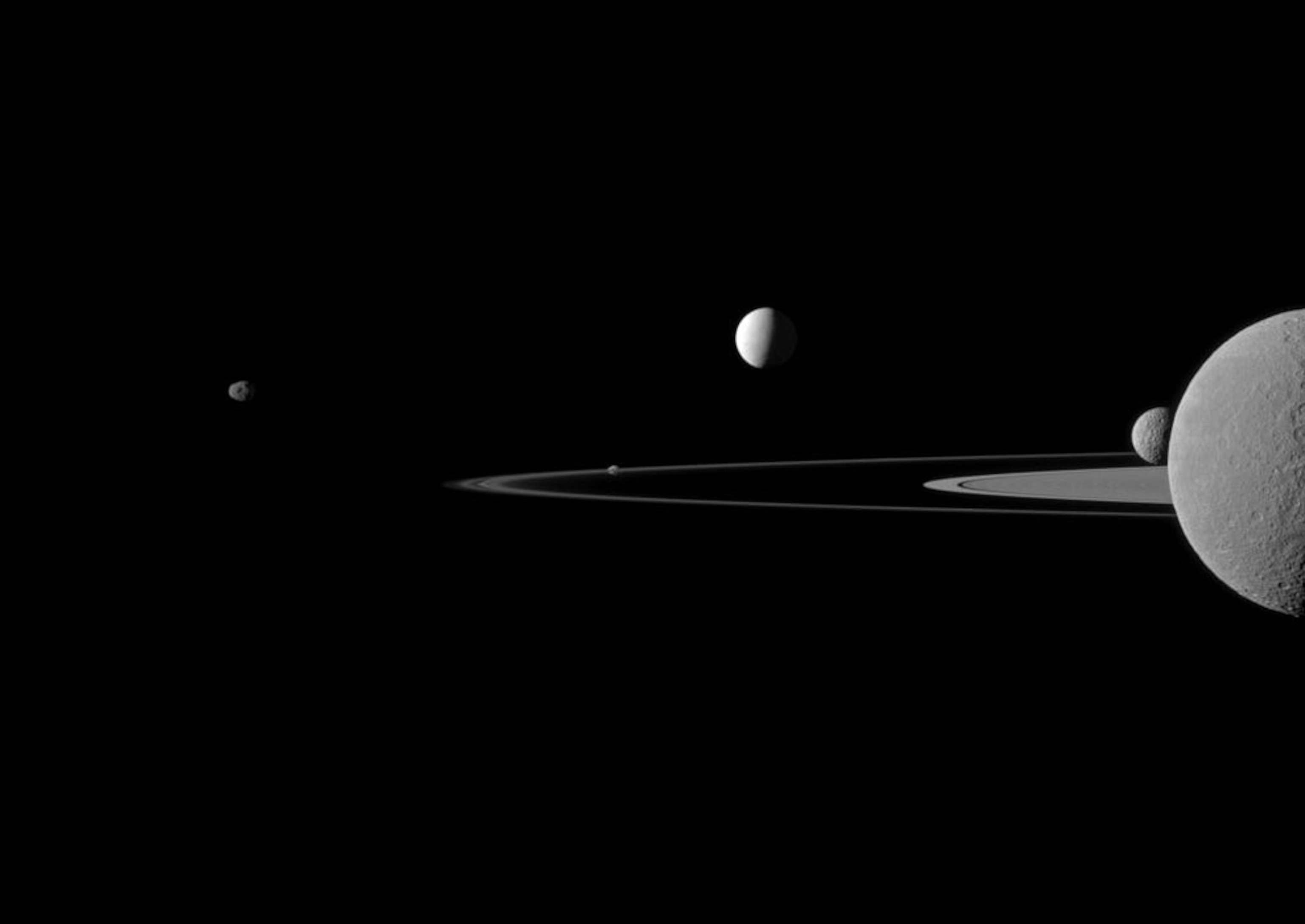 Saturn's rings with five of its moons