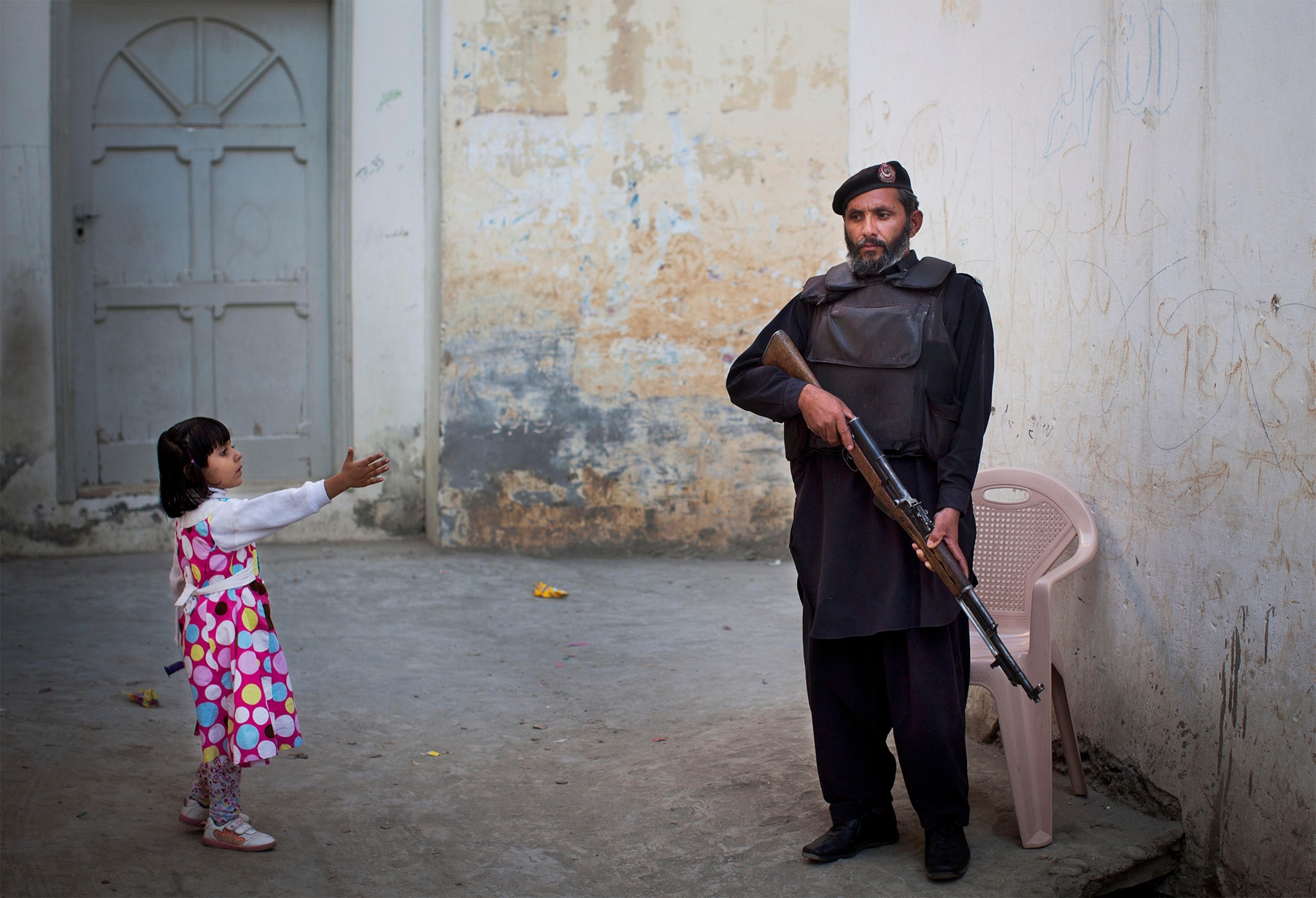 an Afghan National Police officer manning a checkpoint.