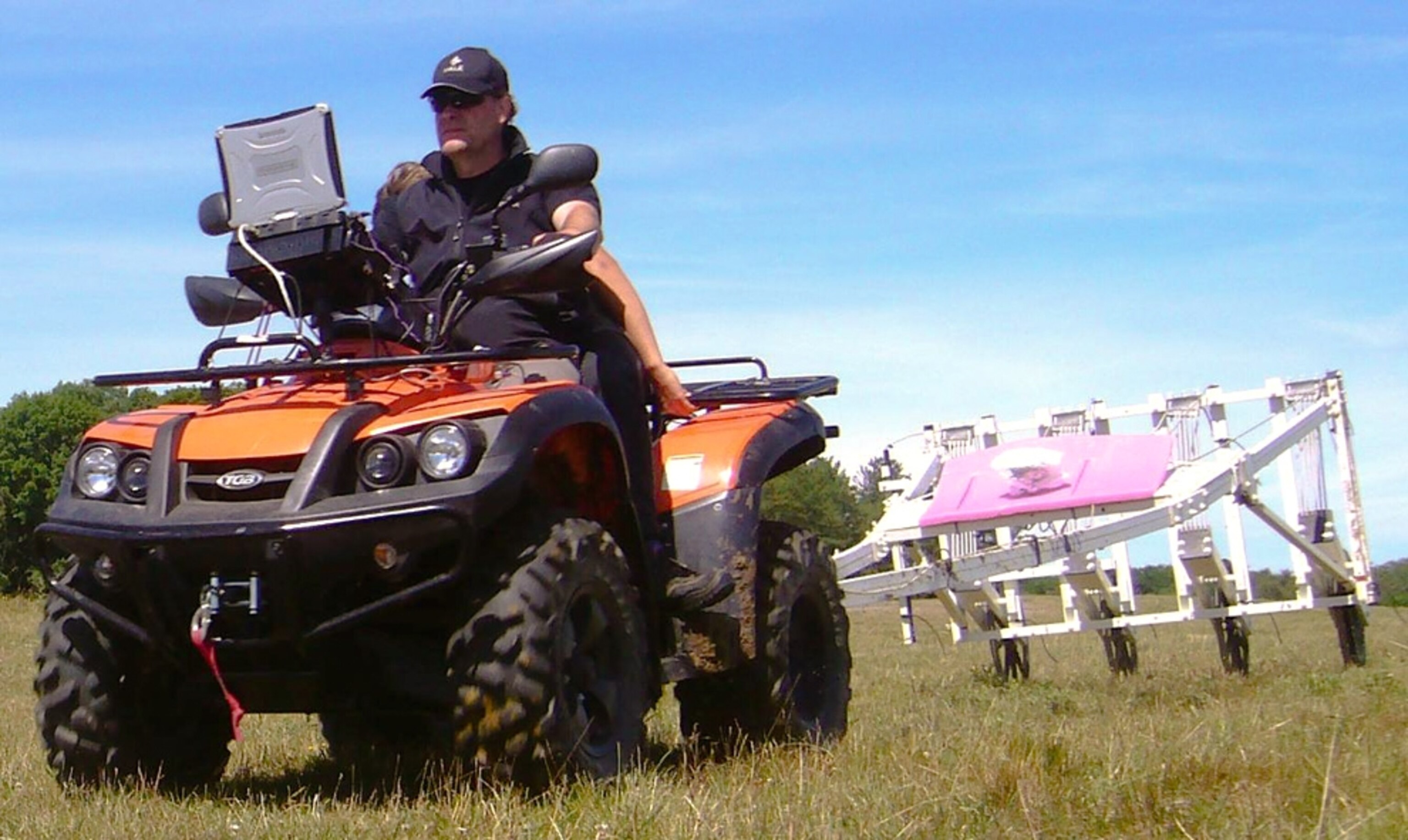 an ATV pulling equipment during a Stonehenge survey.