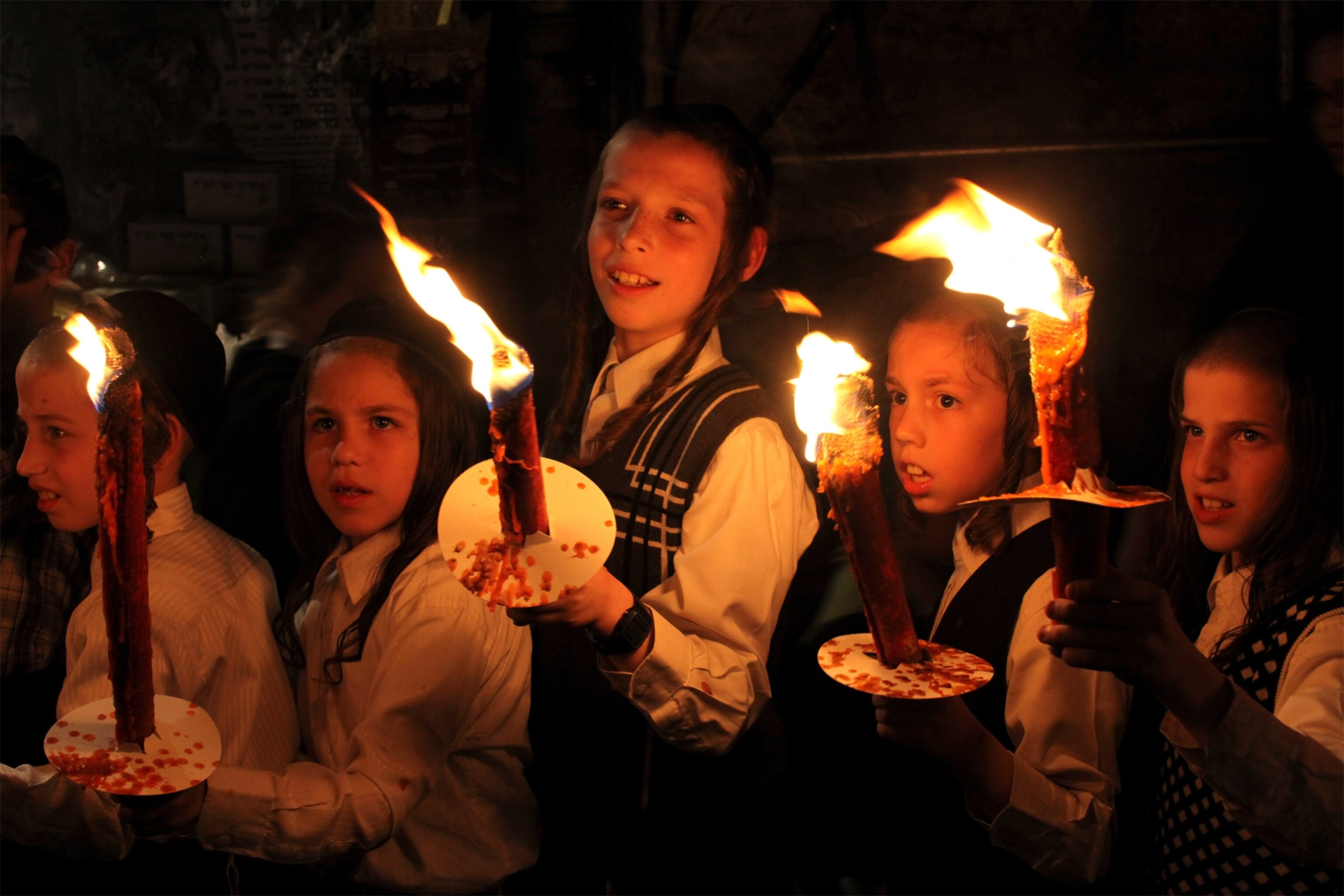 Ultra Orthodox Jewish children celebrating and marching during an inauguration ceremony for a new Torah two days before Yom Kippur.