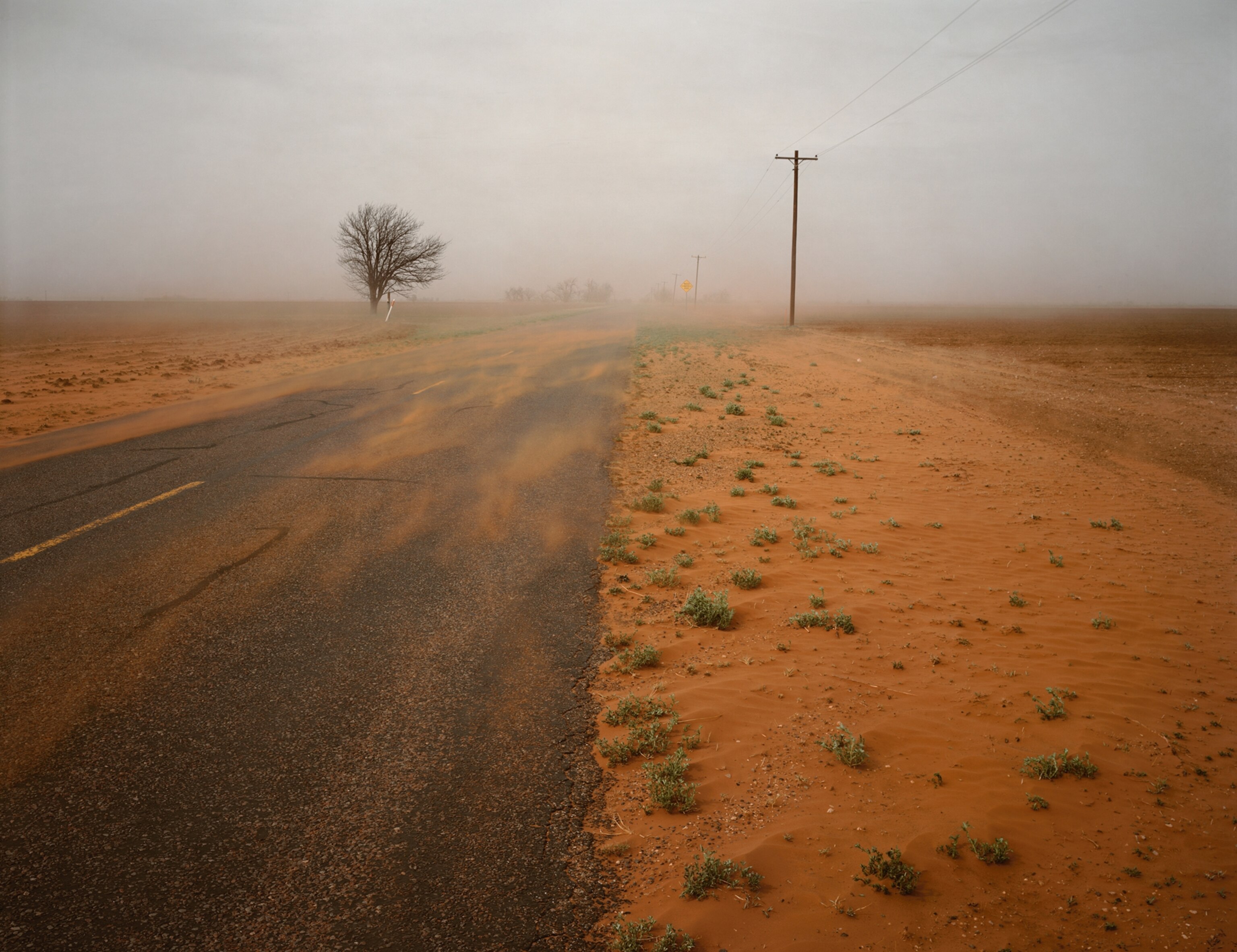 dust blowing down a road in Pep, Texas