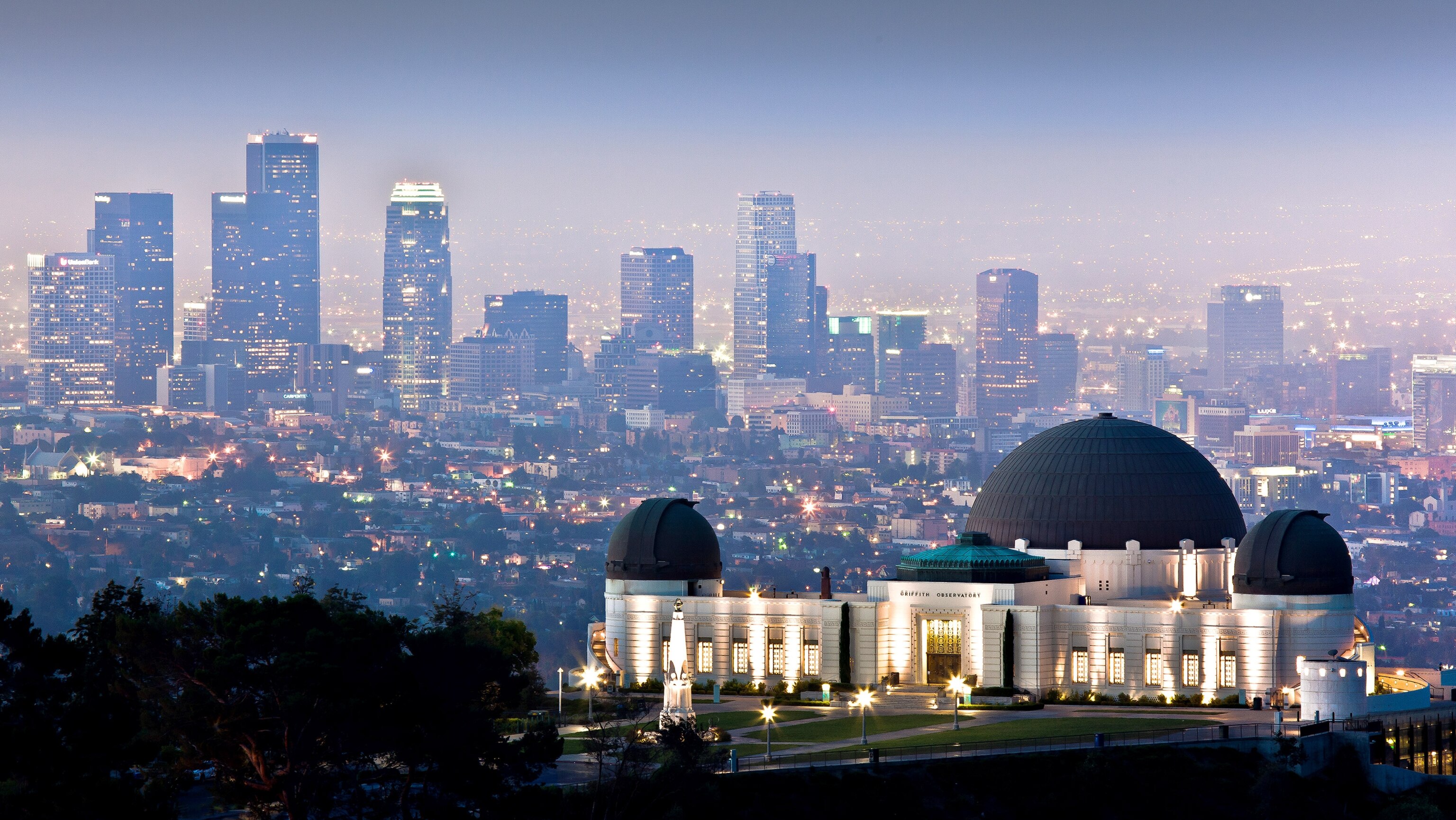 Griffith Observatory with downtown Los Angeles skyline in background.