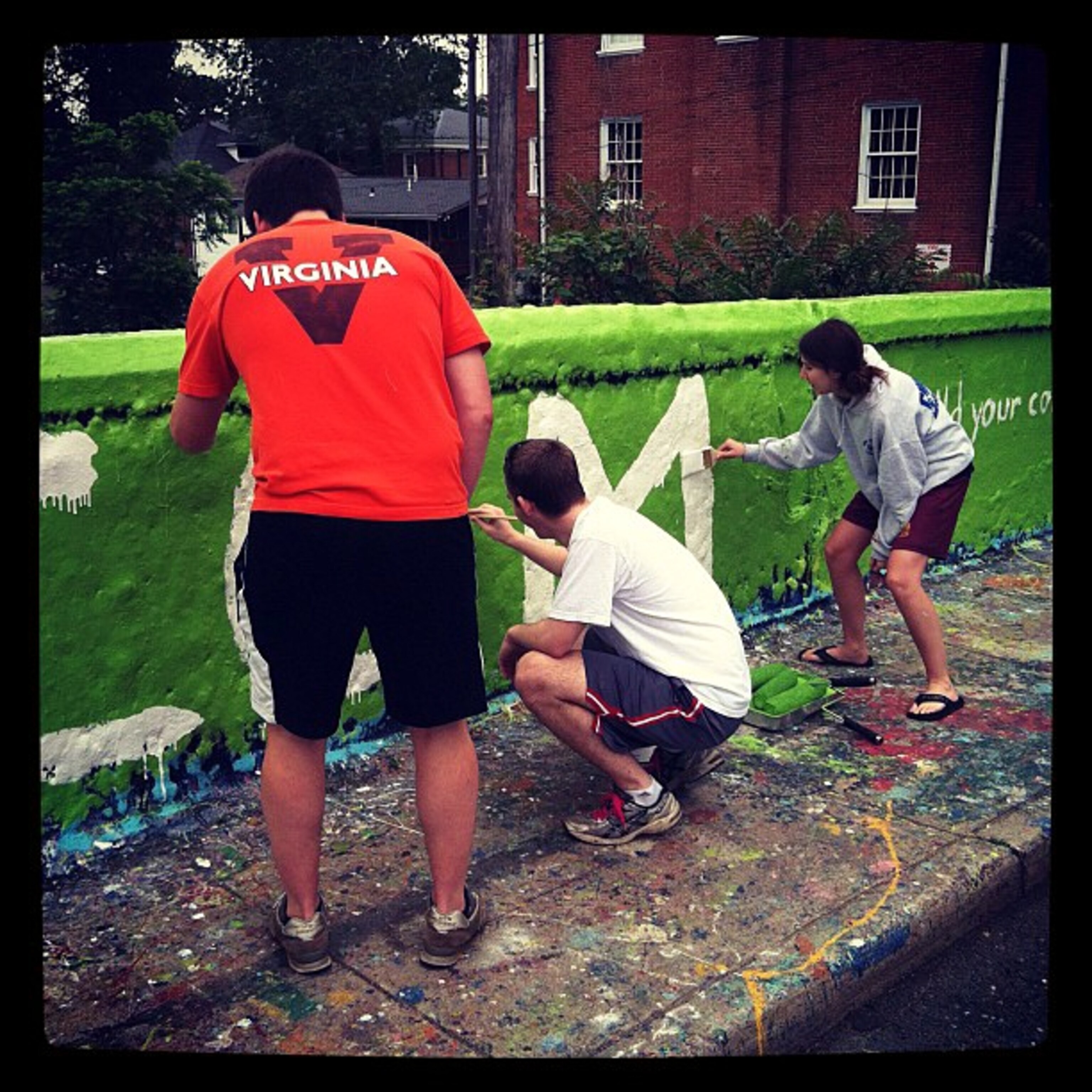 Instagram shot of UVA students painting the Beta Bridge