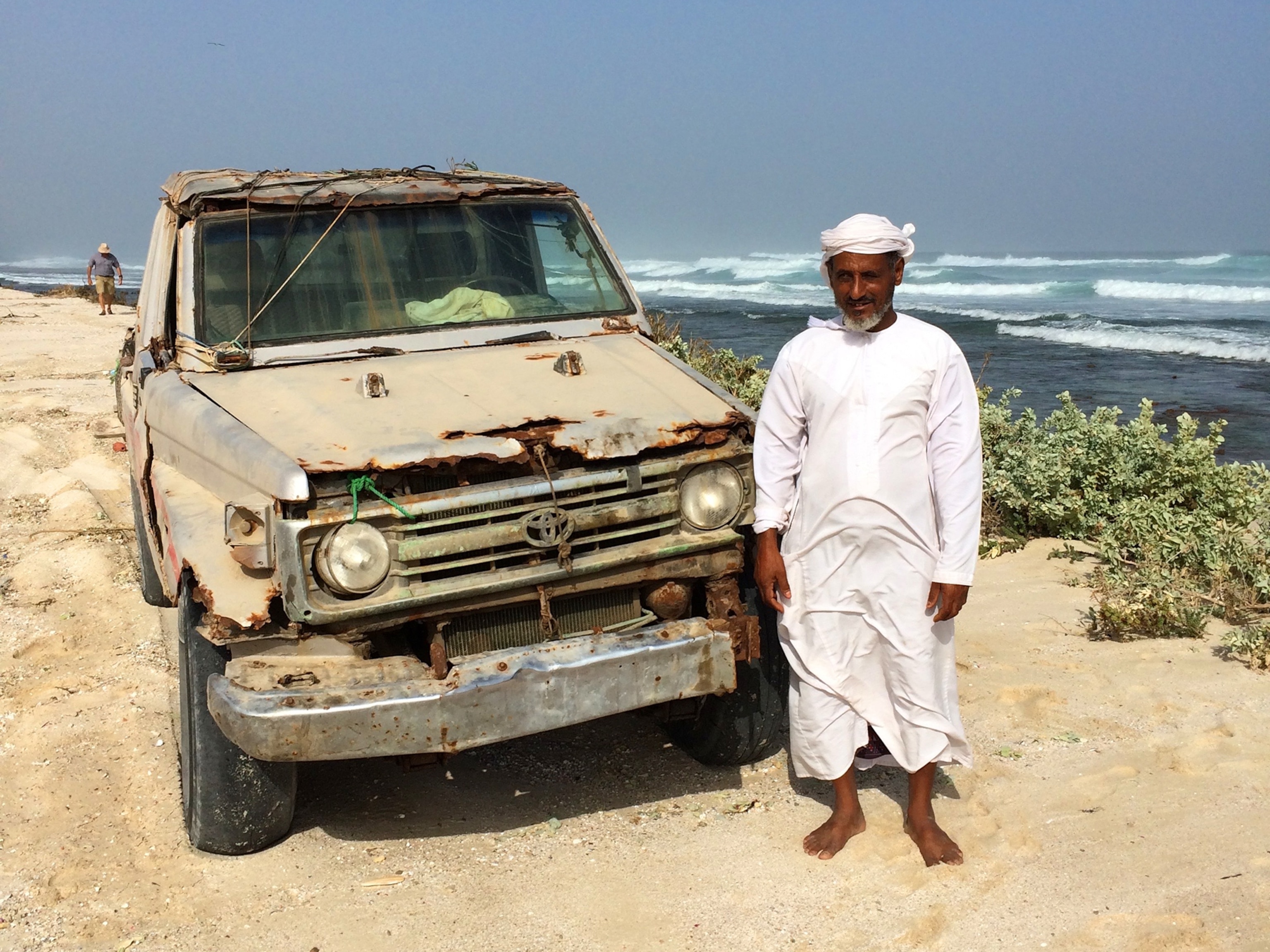 man in front of a truck in Oman