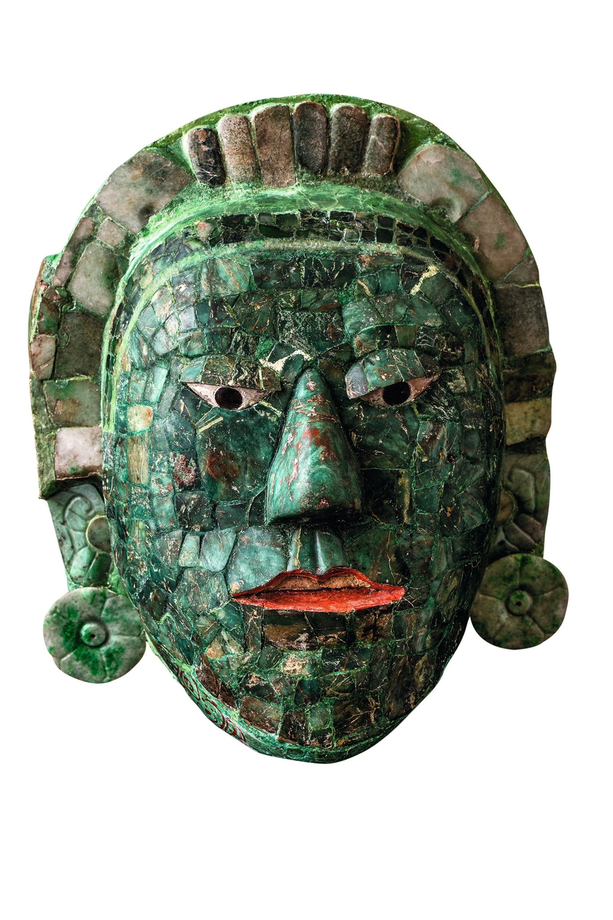 A jade mask that was part of grade goods from the tomb of Jaguar Paw is pictured.