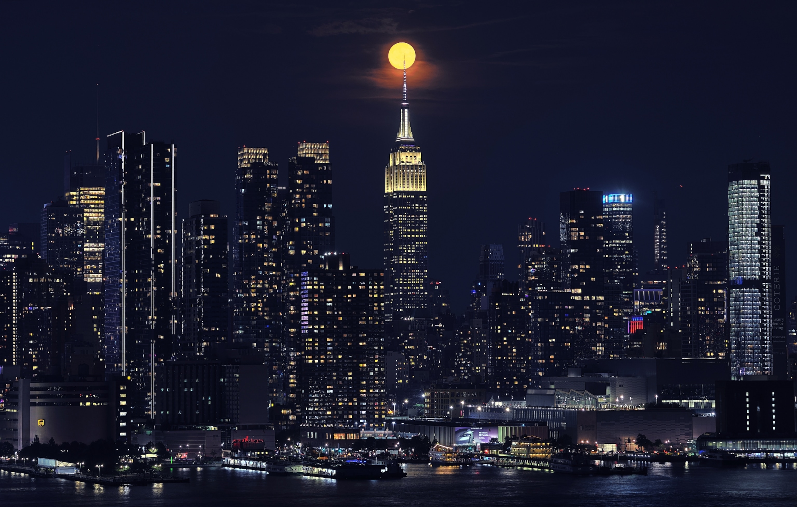 A full Strawberry Moon rising behind the Empire State Building in New York City