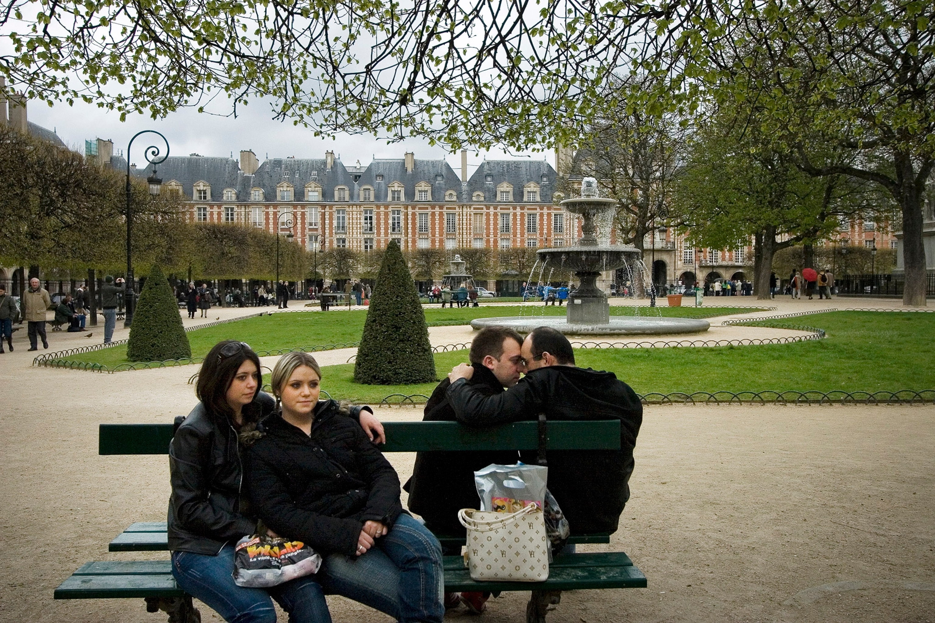 same-sex couples on a bench in Paris