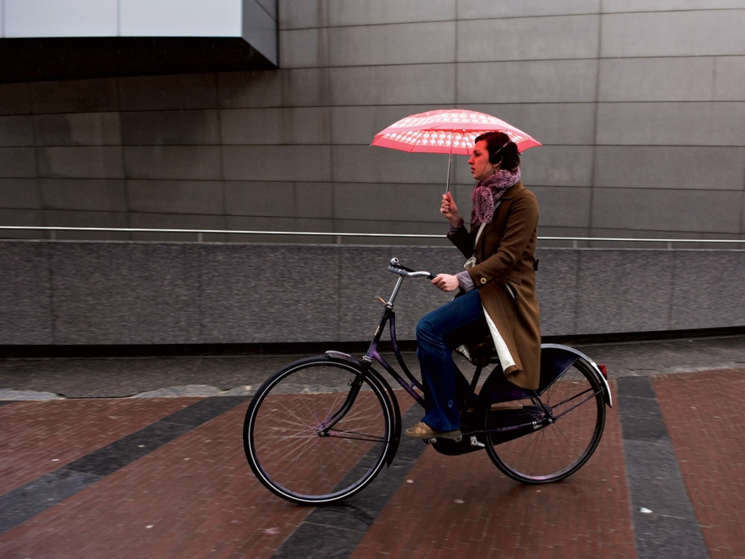 Umbrella-protected bicyclist