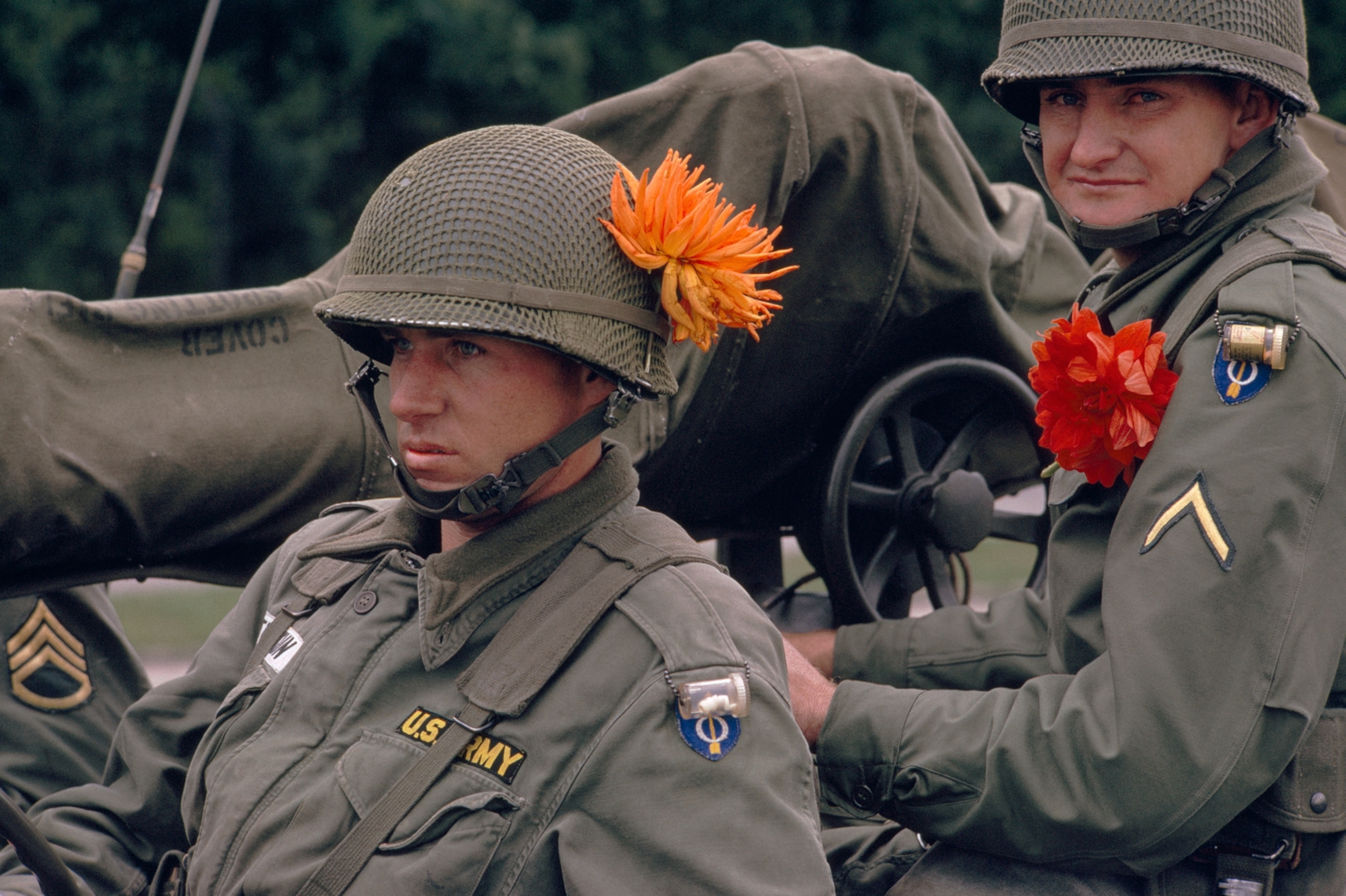Flowers from grateful Berliners greet combat-ready troops of the 1st Battle Group, 18th U.S. Infrantry Regiment, who entered the beleaguered city August 20.