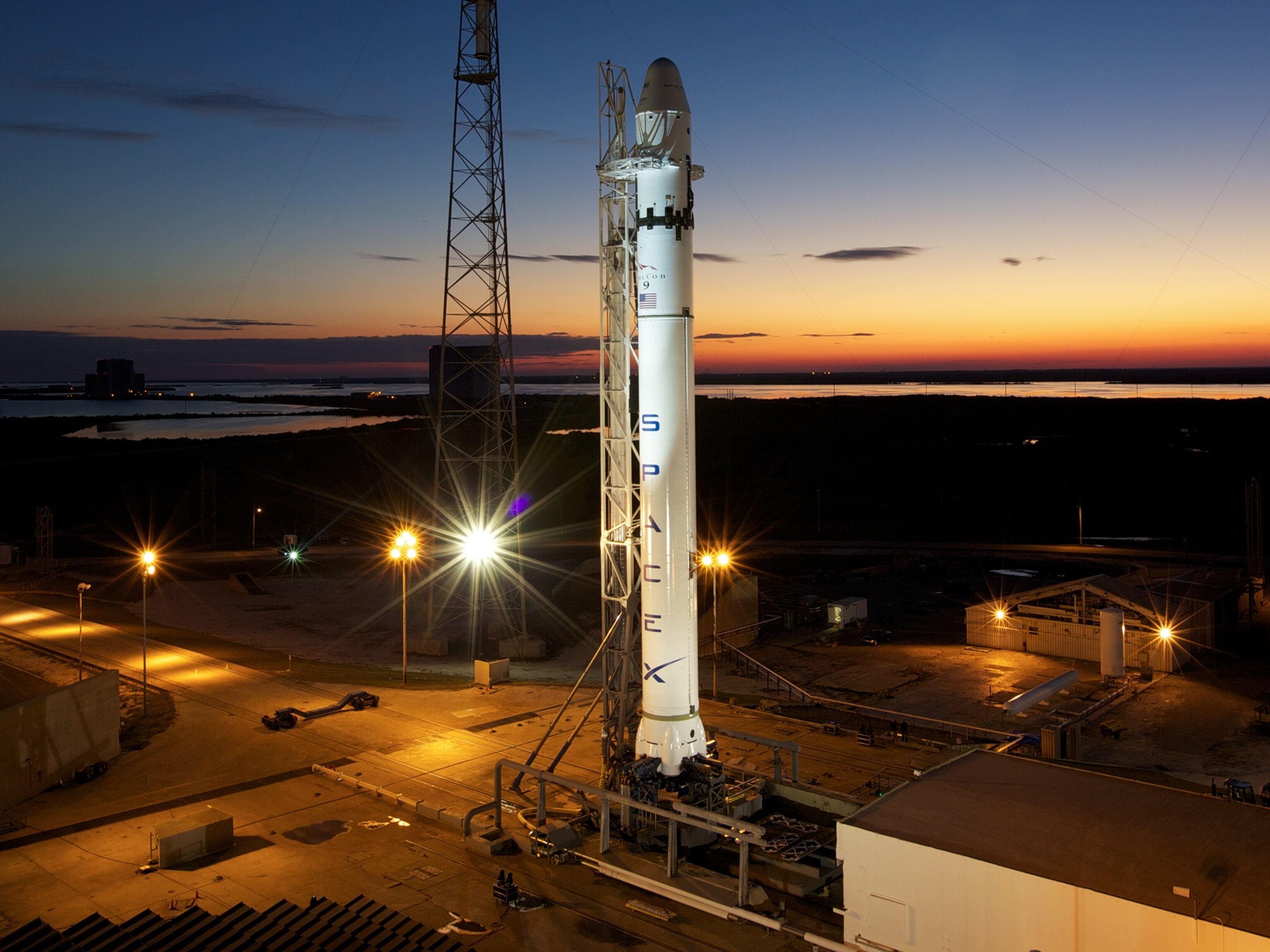 The Falcon 9 on a launch pad.