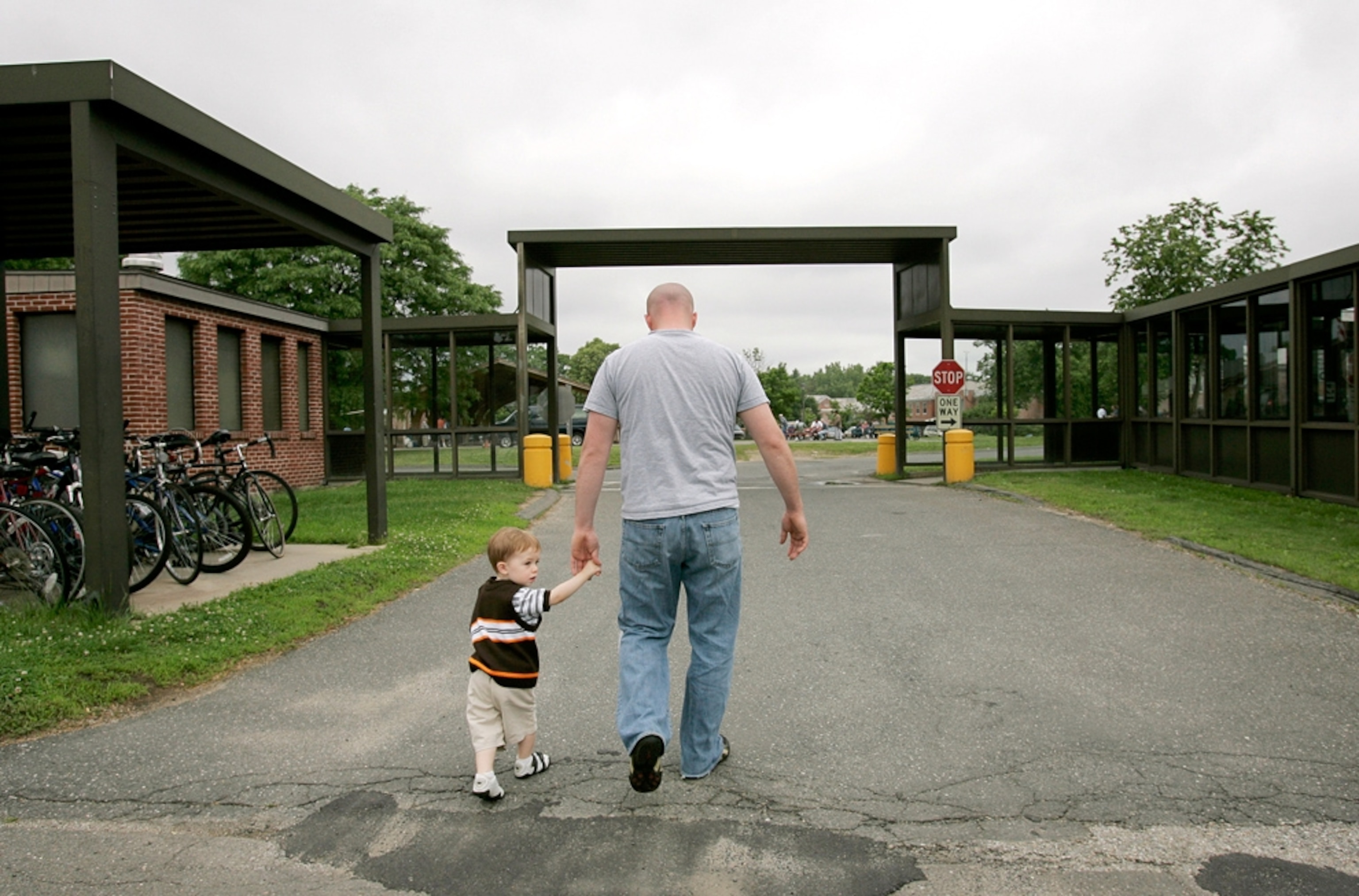 An Iraq veteran walks with his son to a homeless shelter on Father's Day 2008.