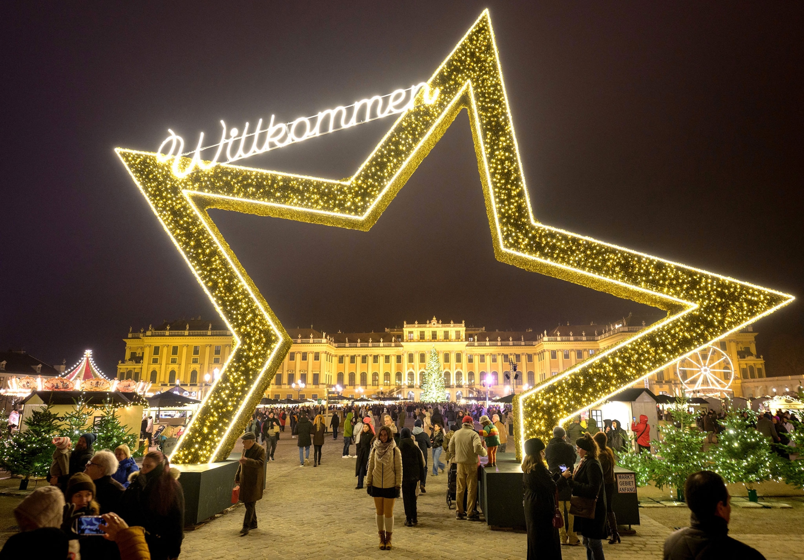 Tourists and locals alike are flooding the grounds of the Christmas market at Schoenbrunn imperial palace just a few weeks before Christmas in Vienna, Austria.