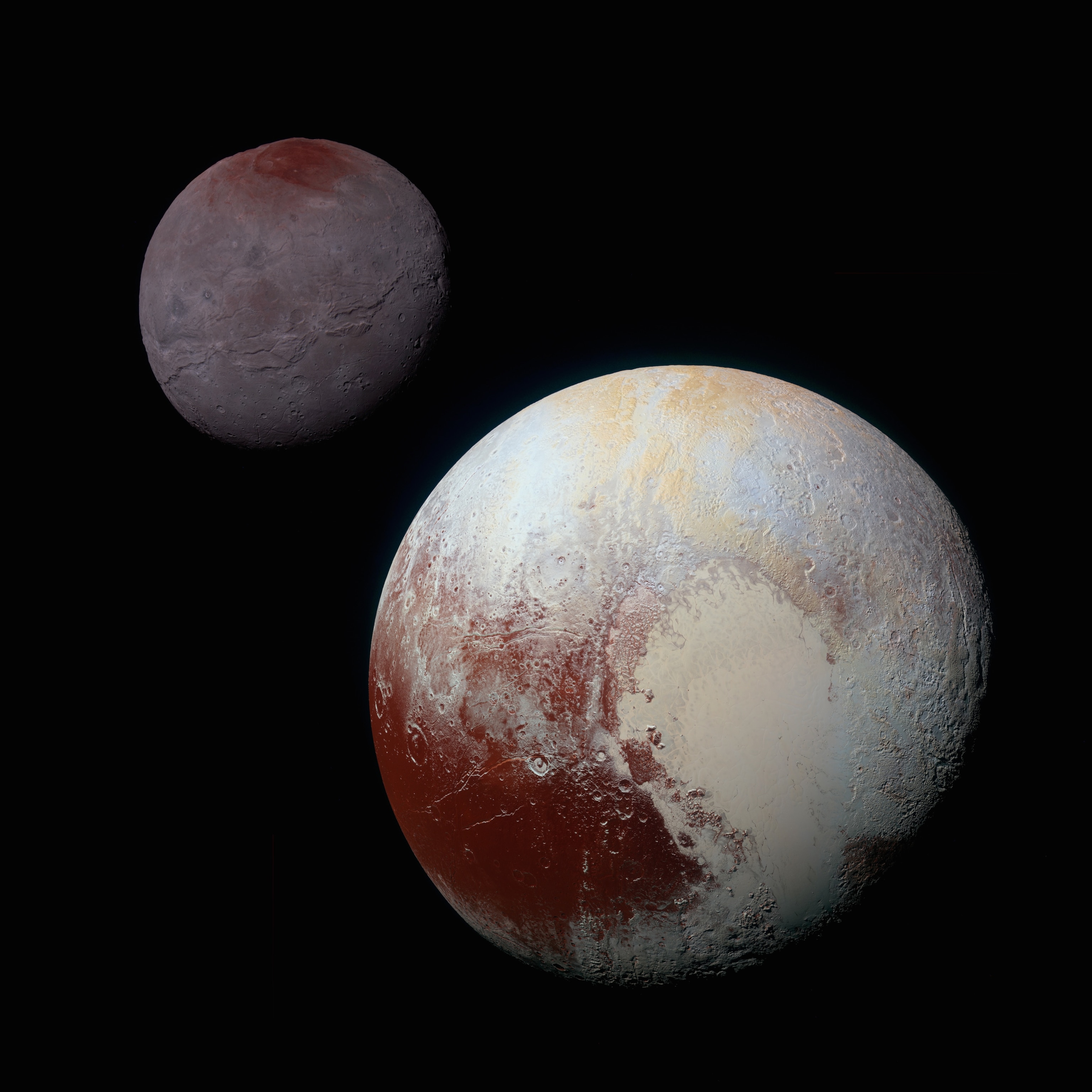 Paintballed Pluto and dark, charred Charon. Click for full-size image. (NASA/JHUAPL/SwRI)