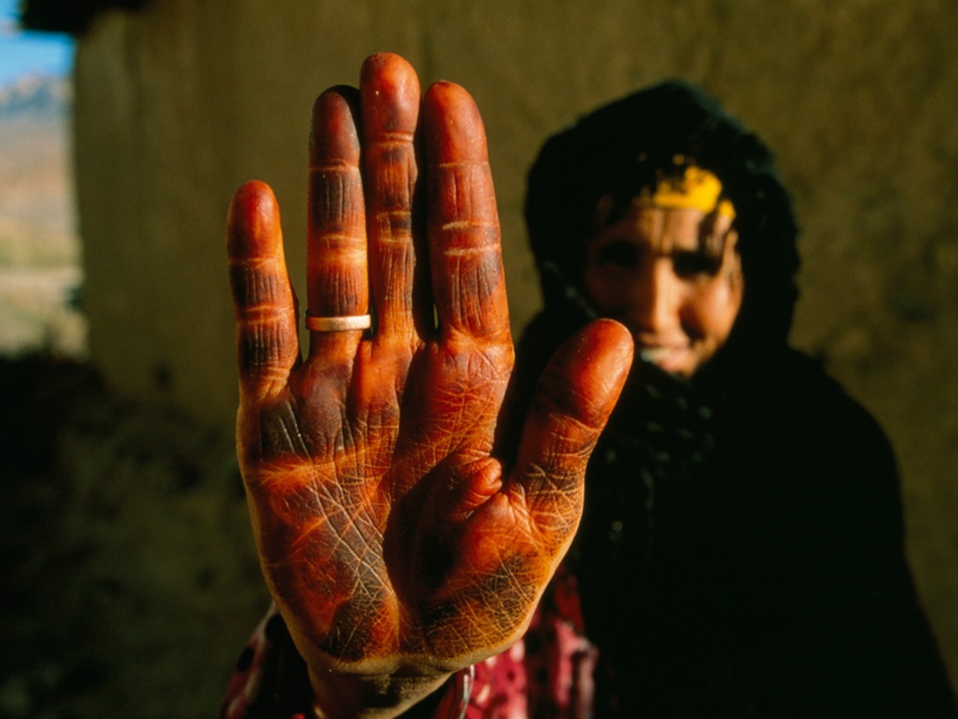 Close-up of a woman’s henna-stained hand