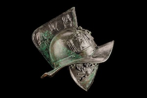 An elaborate murmillo helmet, decorated with depictions of the Muses, was found in the ruins of Pompeii.
