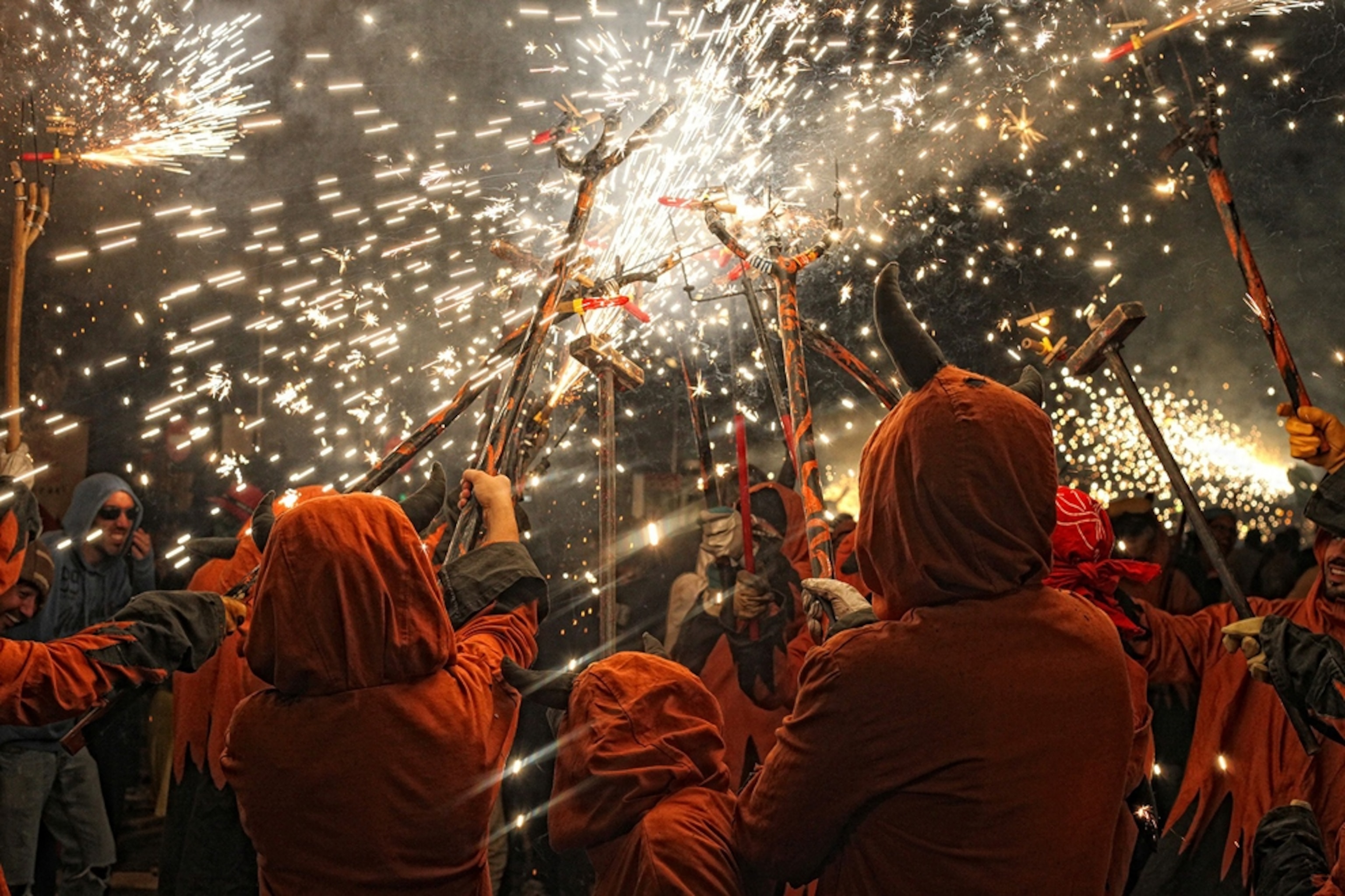 people dressed as devils playing with fire, Spain