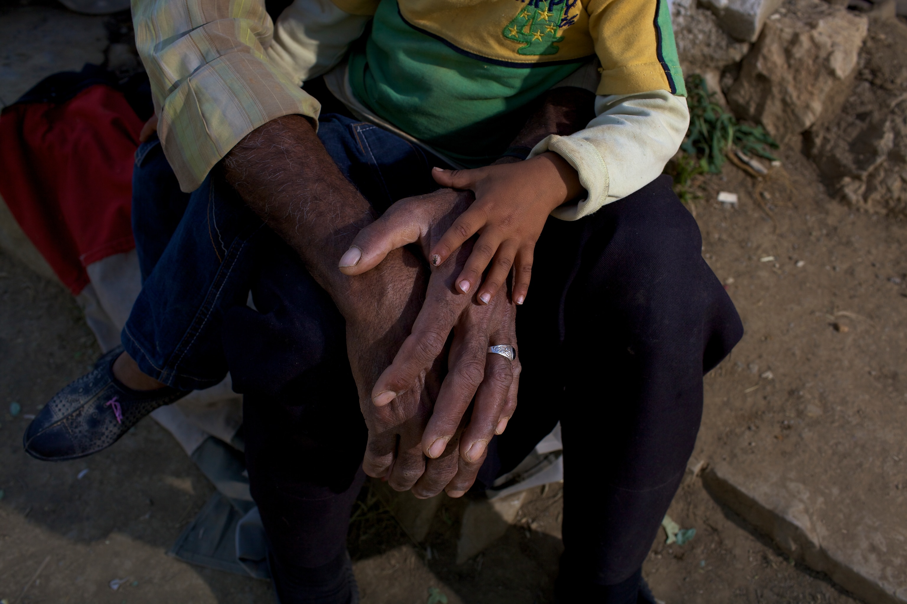 A nomadic herder with his grandson at their summer grazing home.