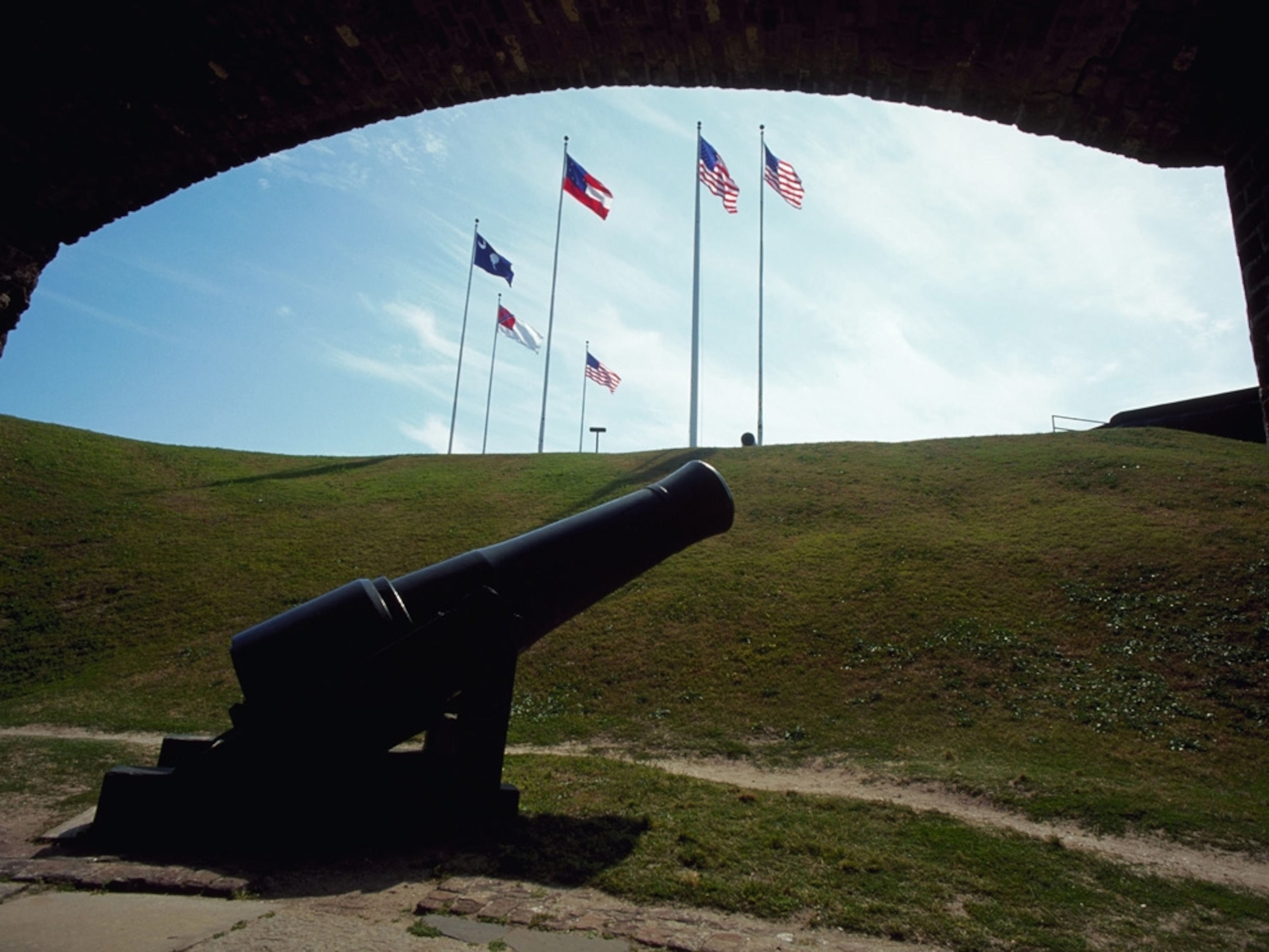 Flags and a cannon at Fort Sumter National Monument in Charleston, South Carolina.