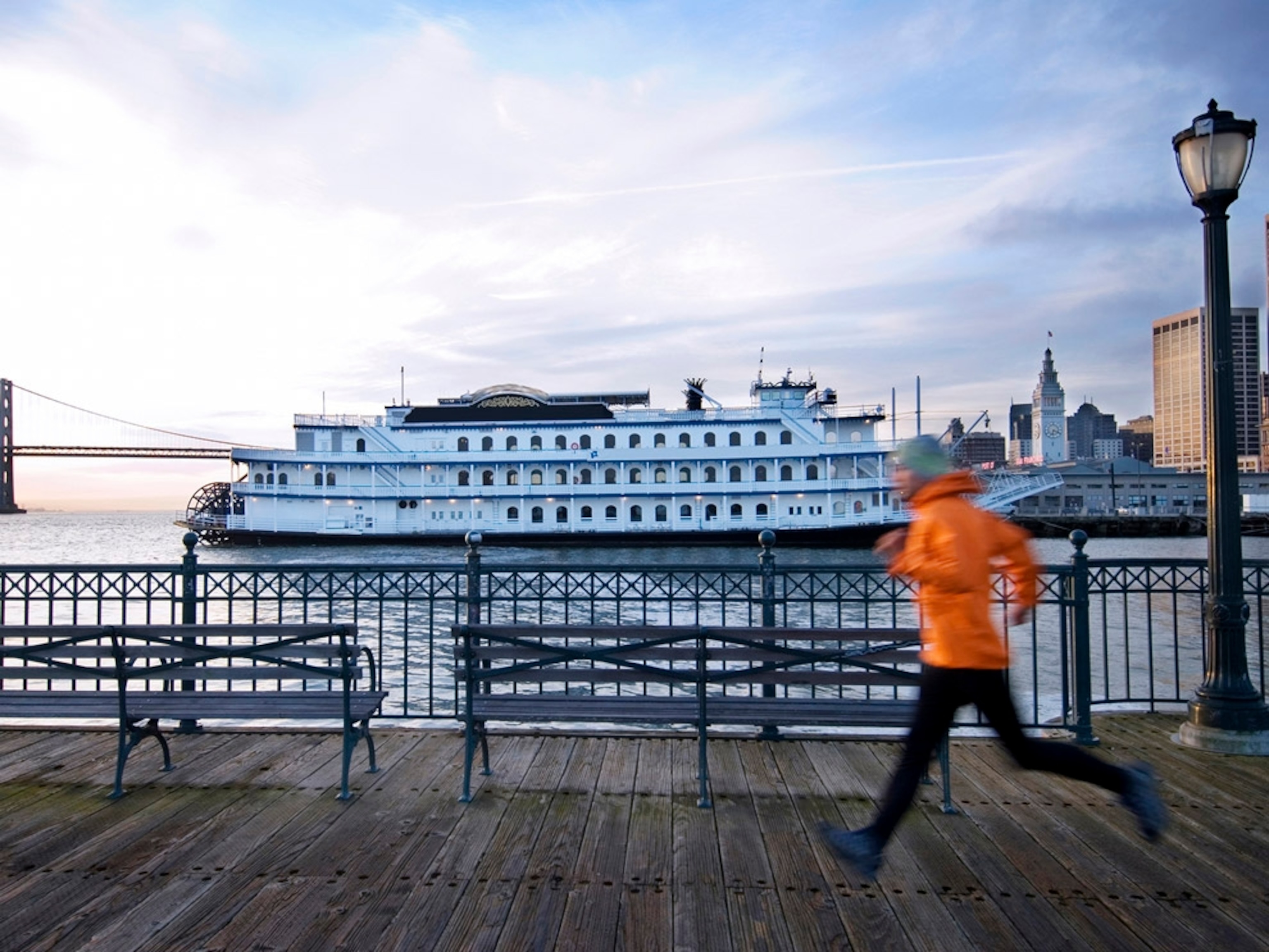 Jogger on waterfront dock