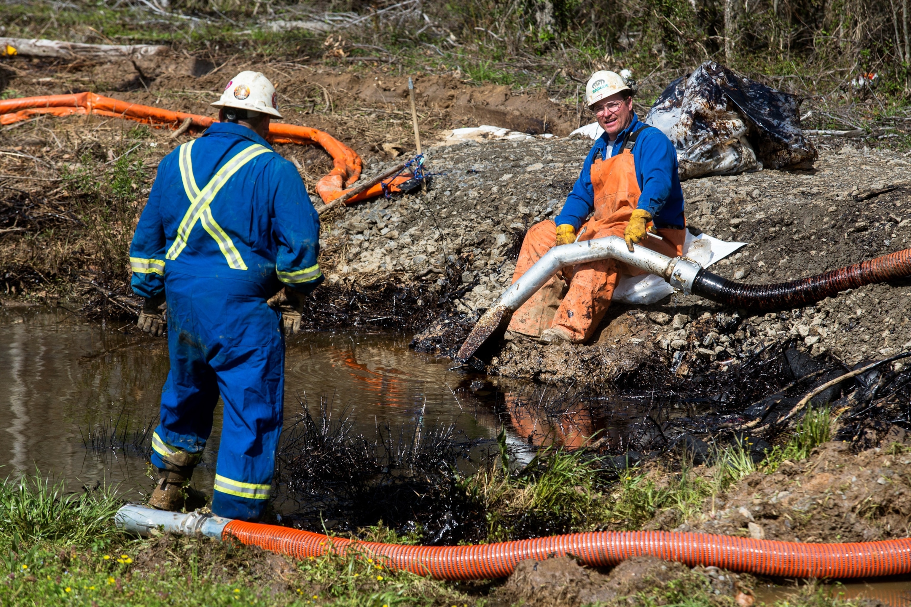 emergency crews cleaning up oil near Interstate 40 in Mayflower, Arkansas