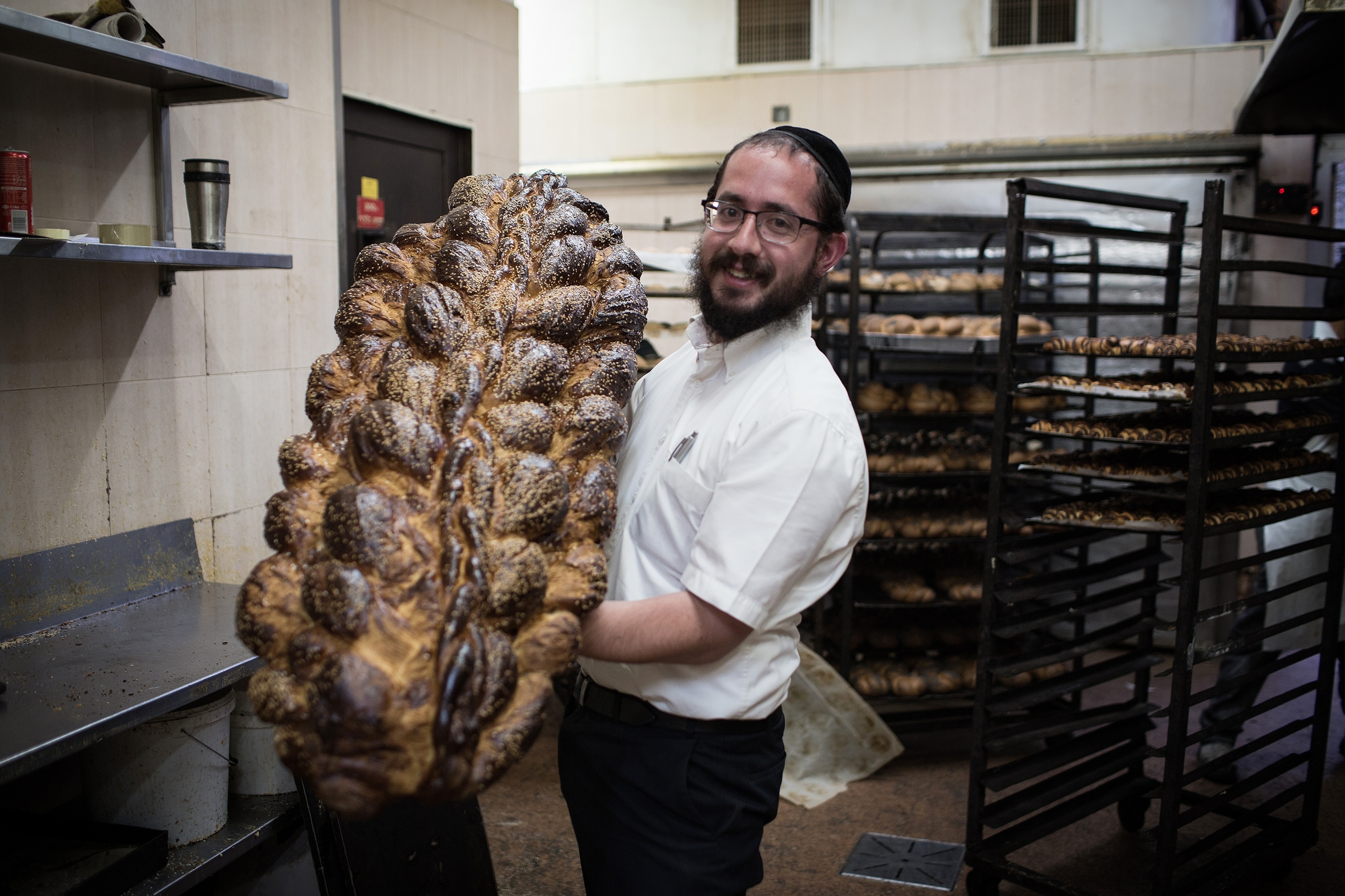 a baker showing a special bread for Shabath in Jerusalem, Israel