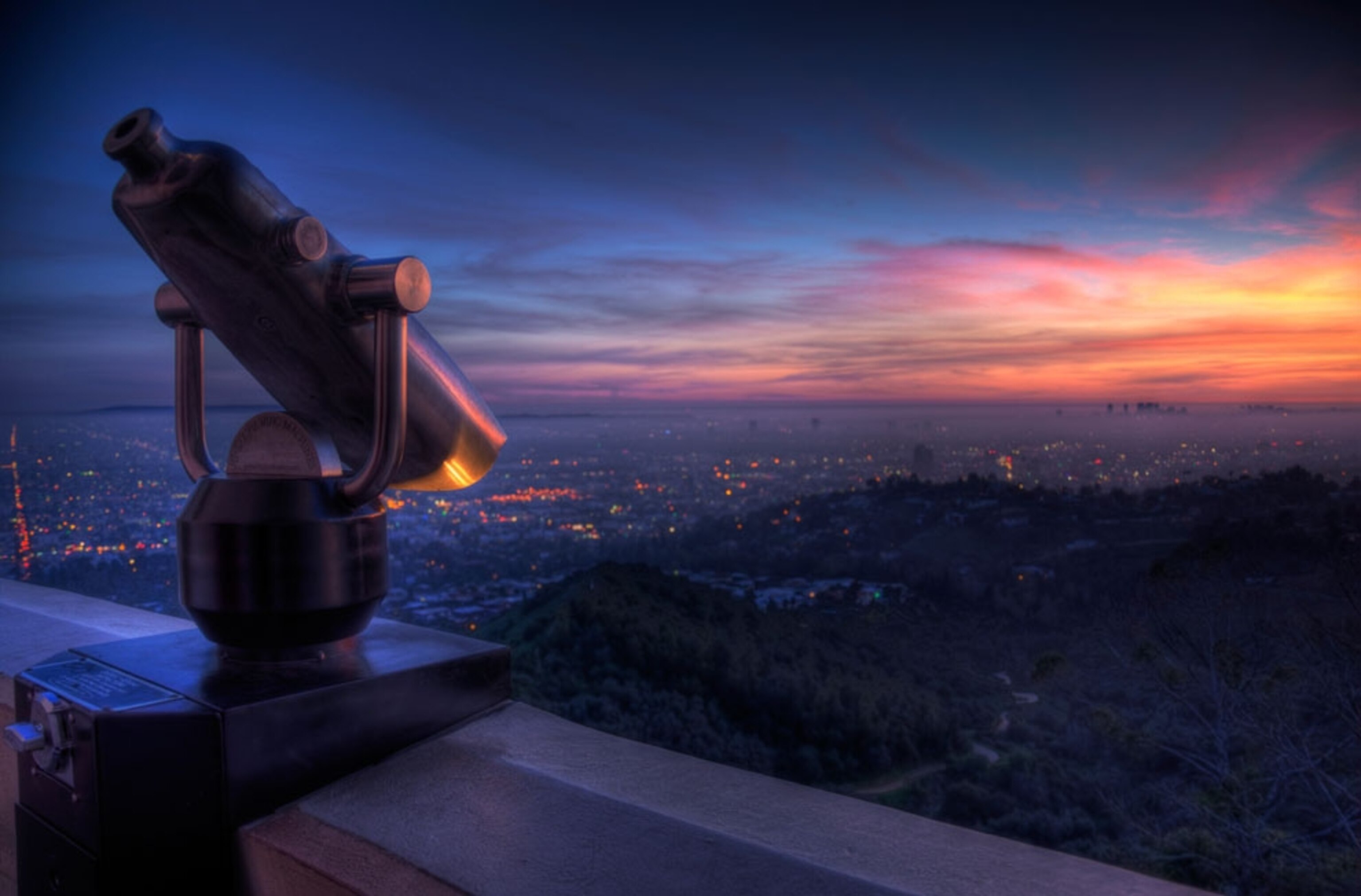 Griffith Park Observatory with sunset over Los Angeles