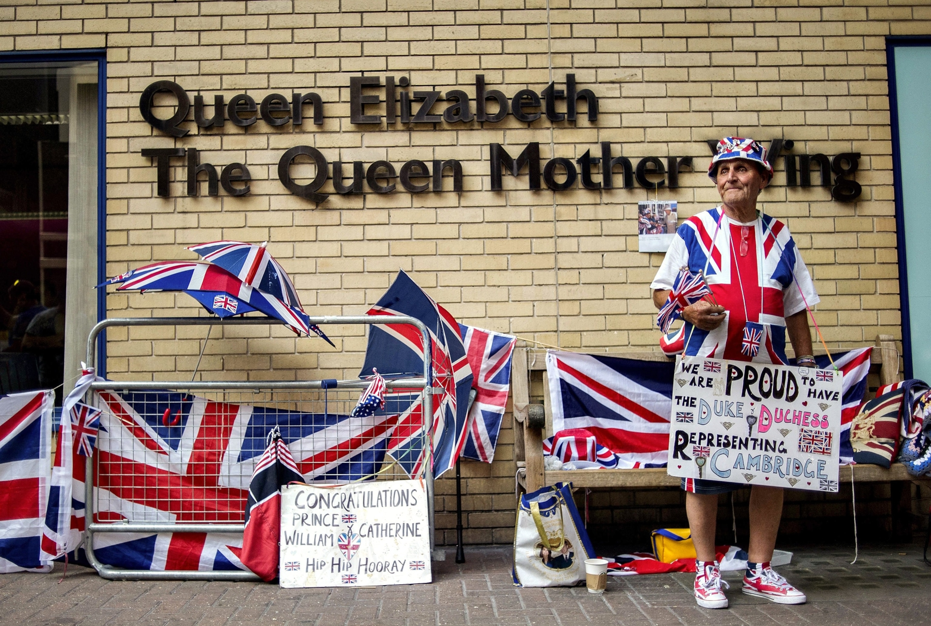 A royal baby enthusiast waits outside a hospital in London, Britain.