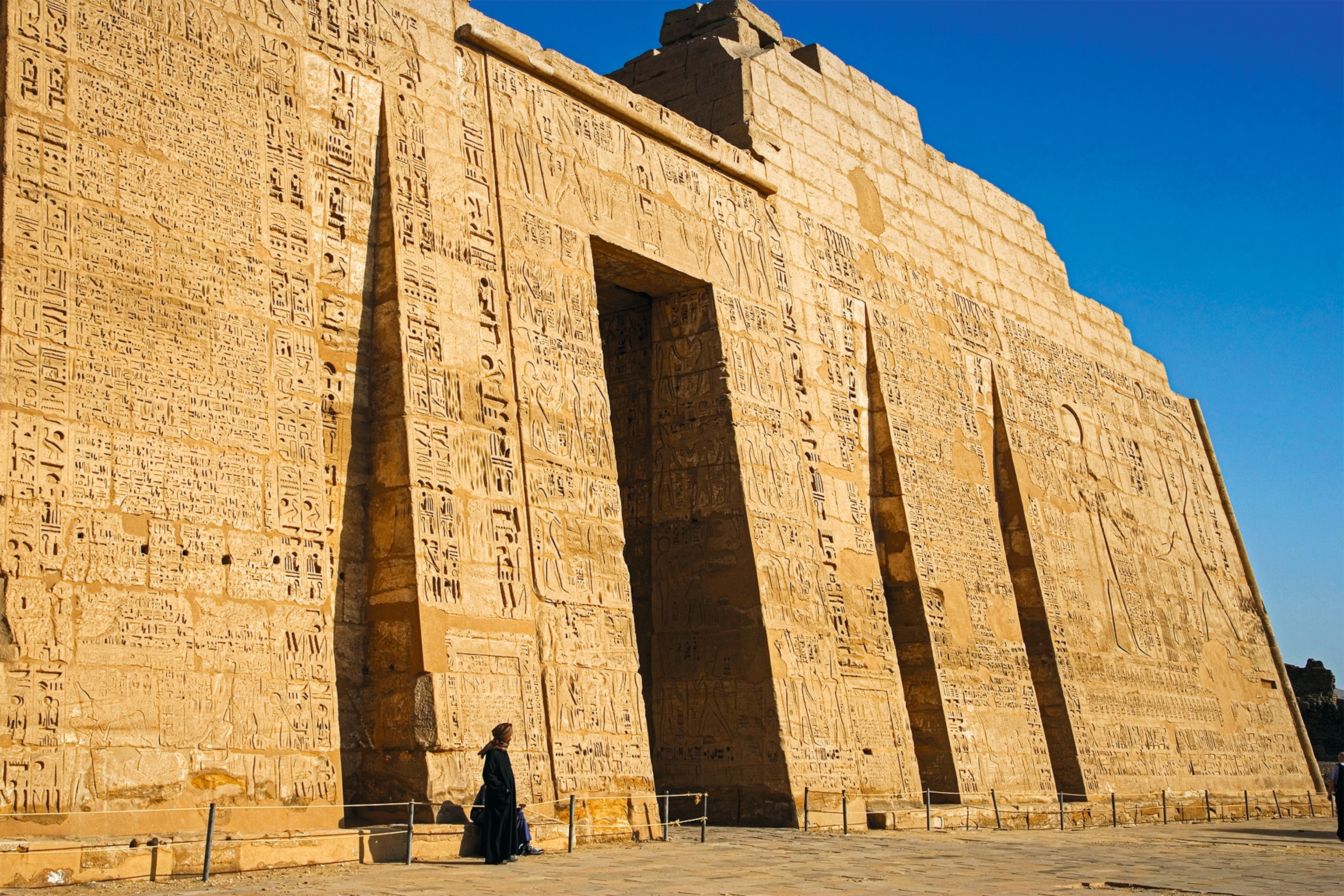 The entrance of Medinet Habu, the temple of Ramses III, is pictured.