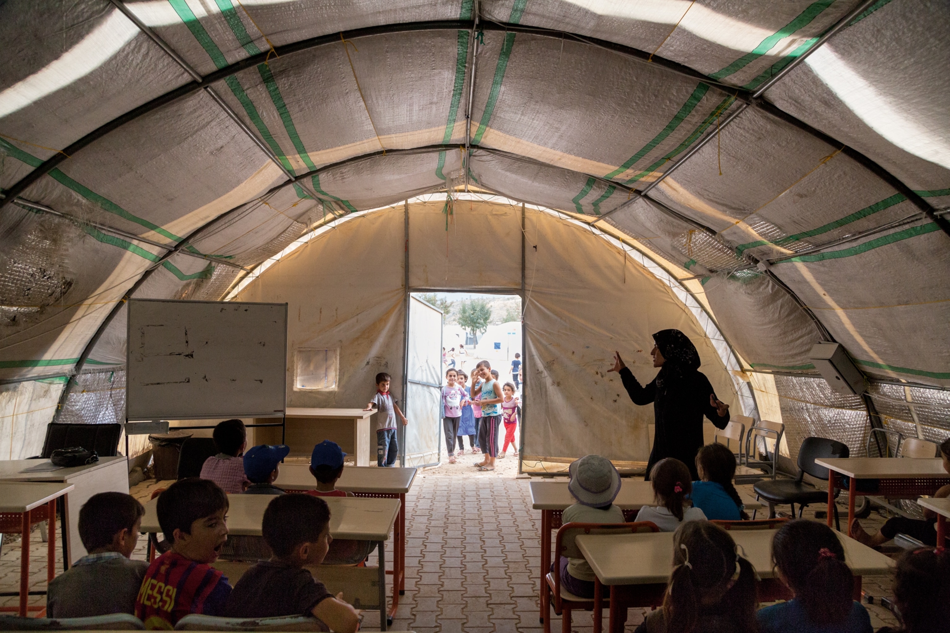 children at a refugee camp school