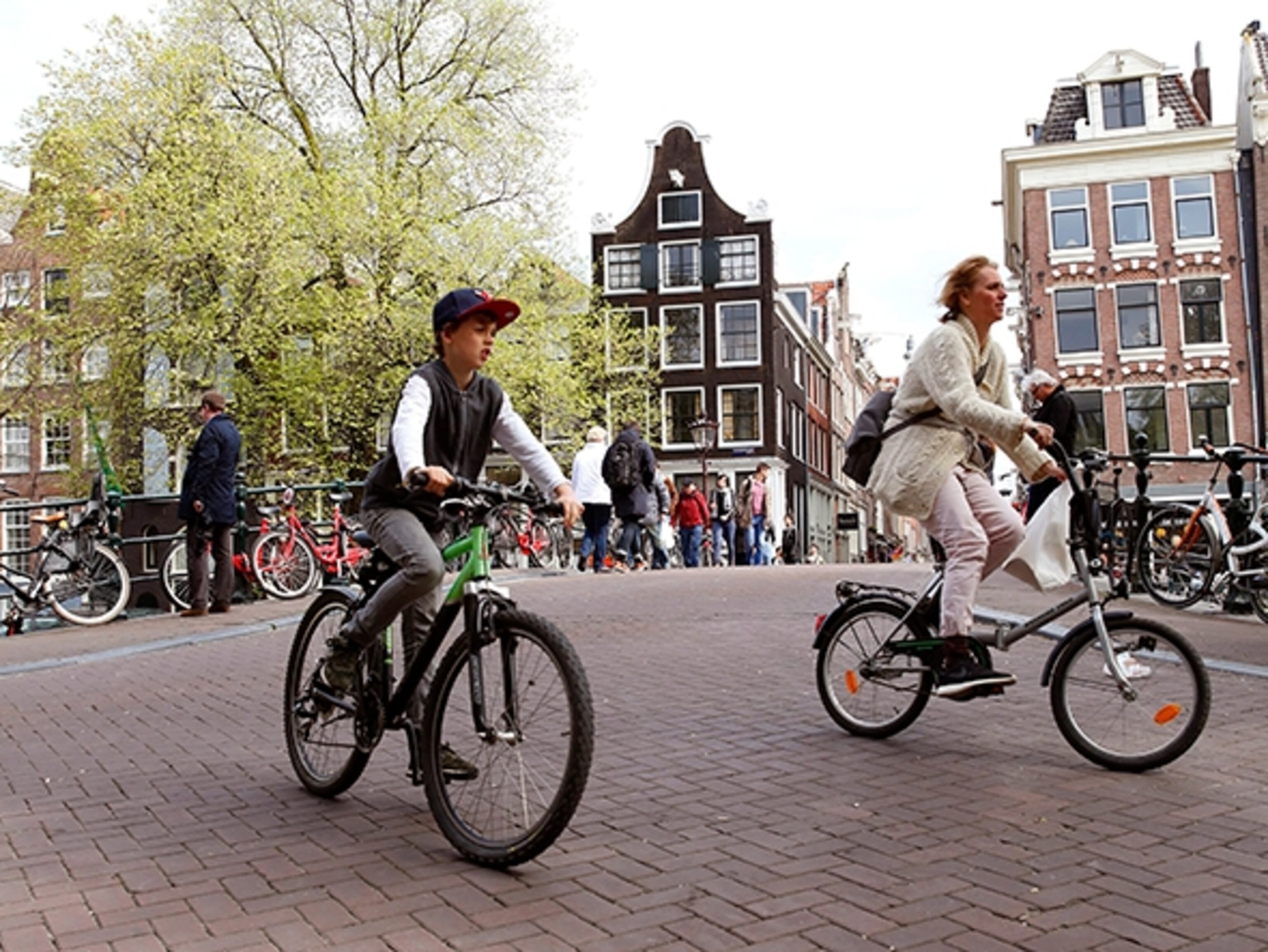 Cyclists rule along the Prinsengracht, one of Amsterdam's three main canals. (Photograph by Miquel Gonzalez)