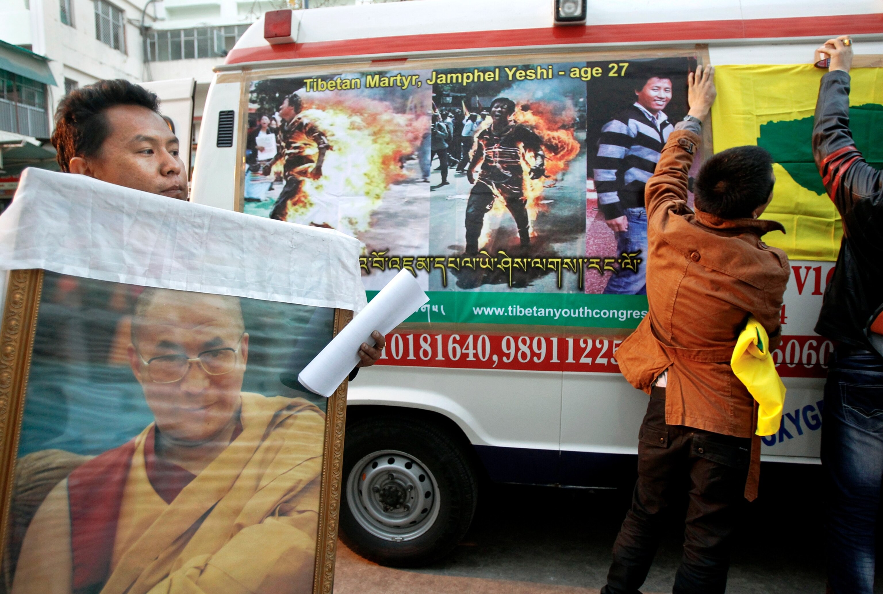 Tibetan protester Jamphel Yeshi on posters, India