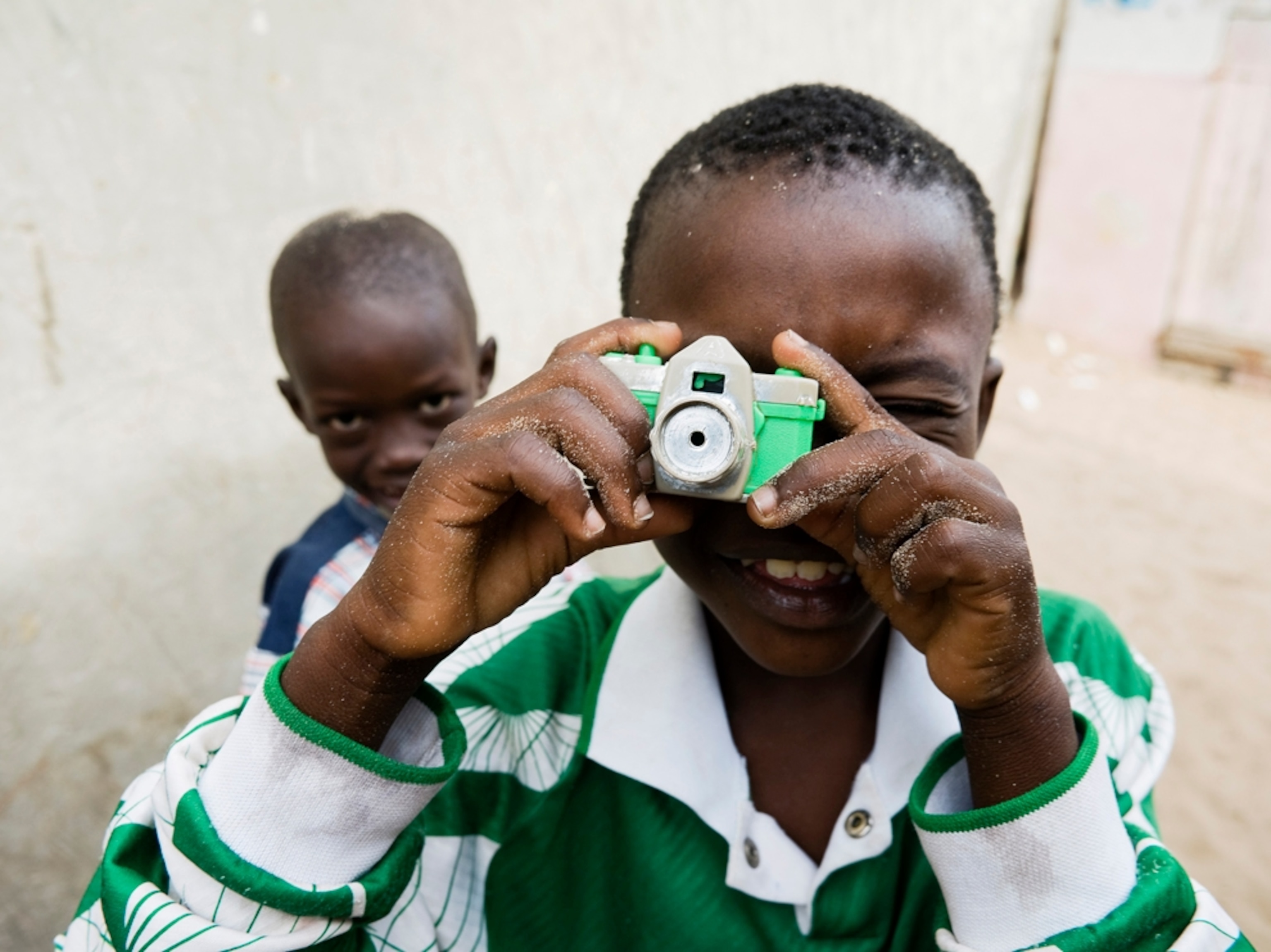 kids playing with toy camera